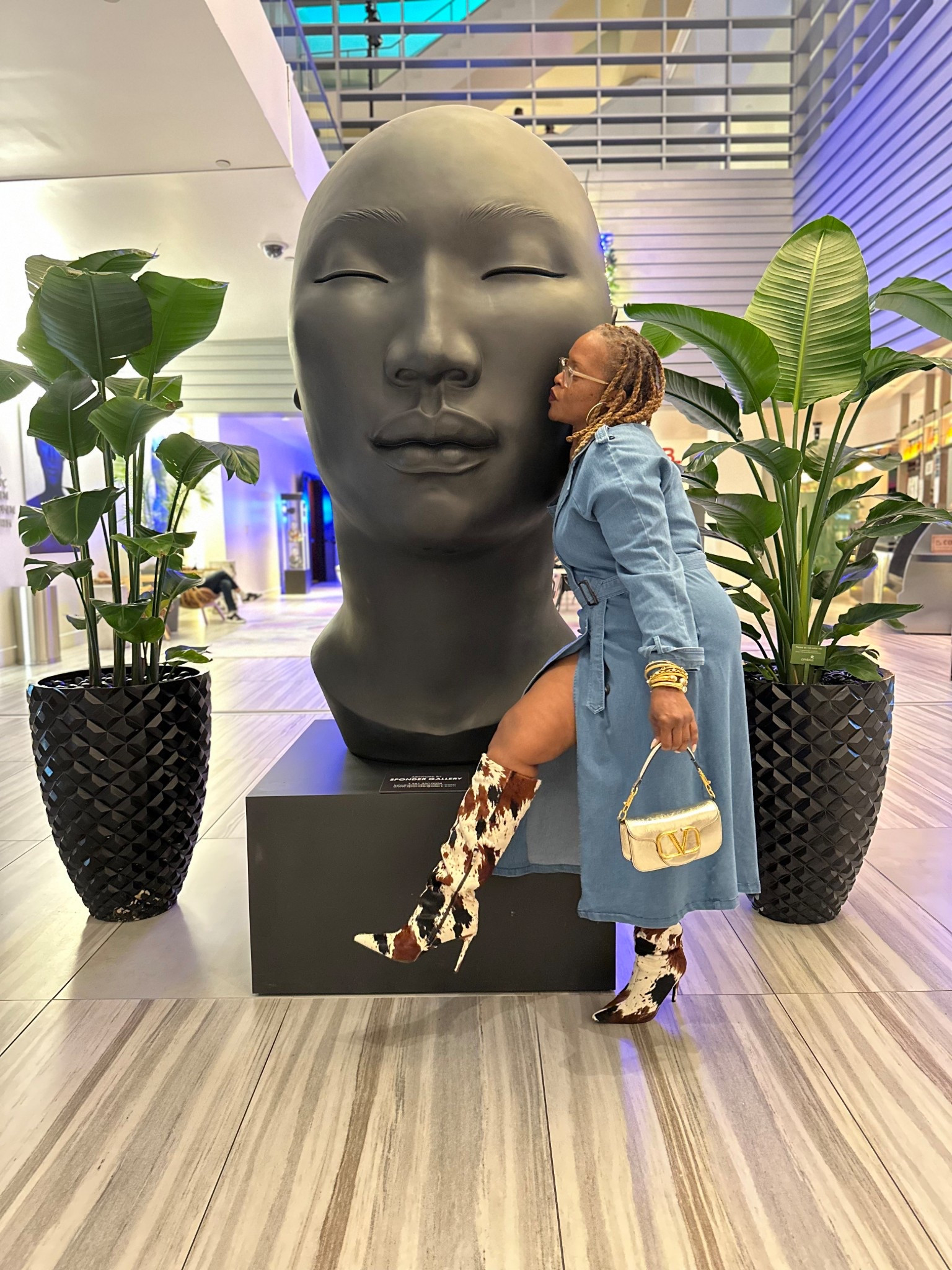 Denim tench coat worn as a dress with Julie Vos gold chunky jewelry and cow print boots 

#LTKootd #LTKdayinmylife #LTKTravel