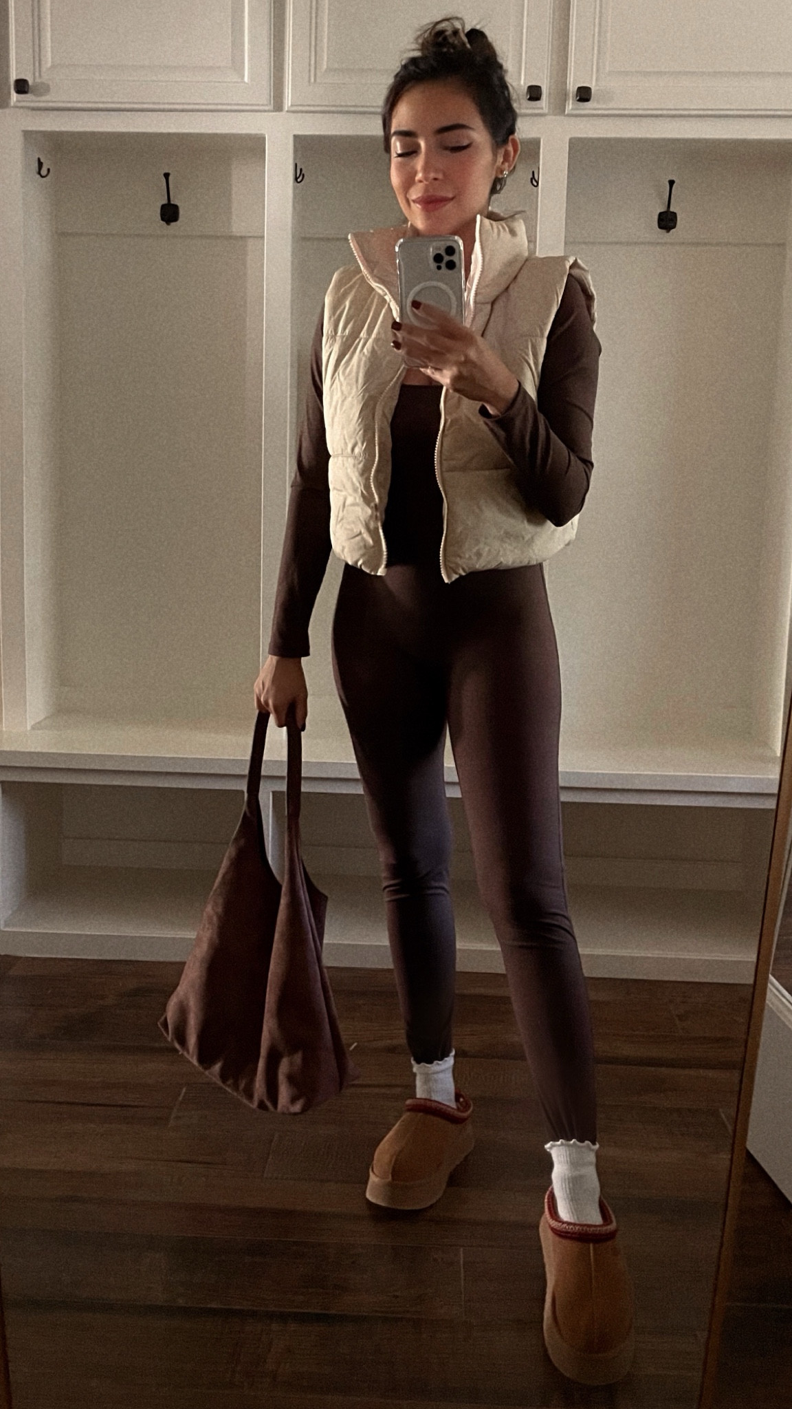 Winter outfit 
Travel outfit 
Cropped puffer vest 
Brown jumpsuit 
Suede brown purse 
Uggs 
Amazon finds 

#LTKHoliday #LTKSeasonal #LTKActive