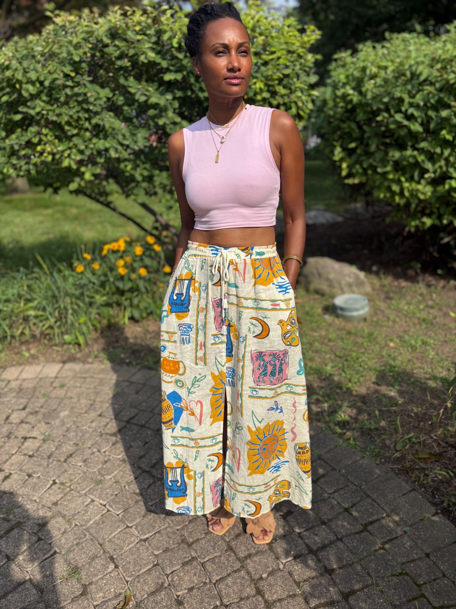 “I love it when the basics come together to make a bold statement. 

This blush pink crew neck cotton crop top from Zara is the perfect neutral base to let this vibrant art deco type print maxi skirt from TJMaxx shine. 

I added natural jute (wicker) sandal slides with a floral appliqué embellishment I picked up from Rainbow to keep the look effortlessly grounded — ideal for brunch, lunch, or any casual day out. 
A little color, a lot of comfort, and total style. Tap to shop the full look!”

•Top: Sleeveless cotton jersey crop in blush pink
•Skirt: Ethnic tribal print maxi with drawstring waist + front slit
•Shoes: Tweed nude slides with embellished floral appliqué 

#LTKStyleTip #LTKOver40 #LTKSeasonal