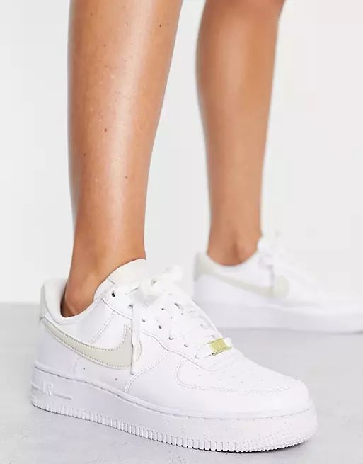 Nike Air Force 1 '07 Next Nature sneakers in white and gold metallic | ASOS (Global)
