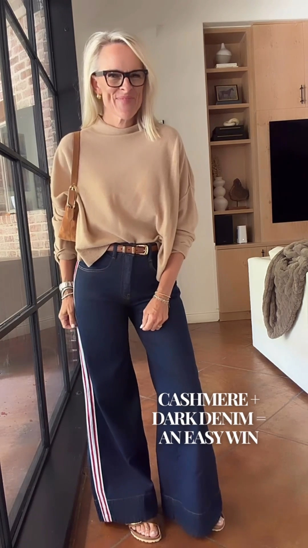 I’ve had this cashmere sweater for several seasons, and it’s one of those pieces I can always count on. I paired it with dark denim and the sporty stripe detail for an easy everyday outfit that feels comfortable and polished.

The sandals I’m wearing here are currently unavailable, so I’m tagging another option that I think would work beautifully with this outfit. It’s a great example of why I love investing in timeless pieces that can be worn season after season.

#LTKootd #LTKOver40 #LTKgrwm