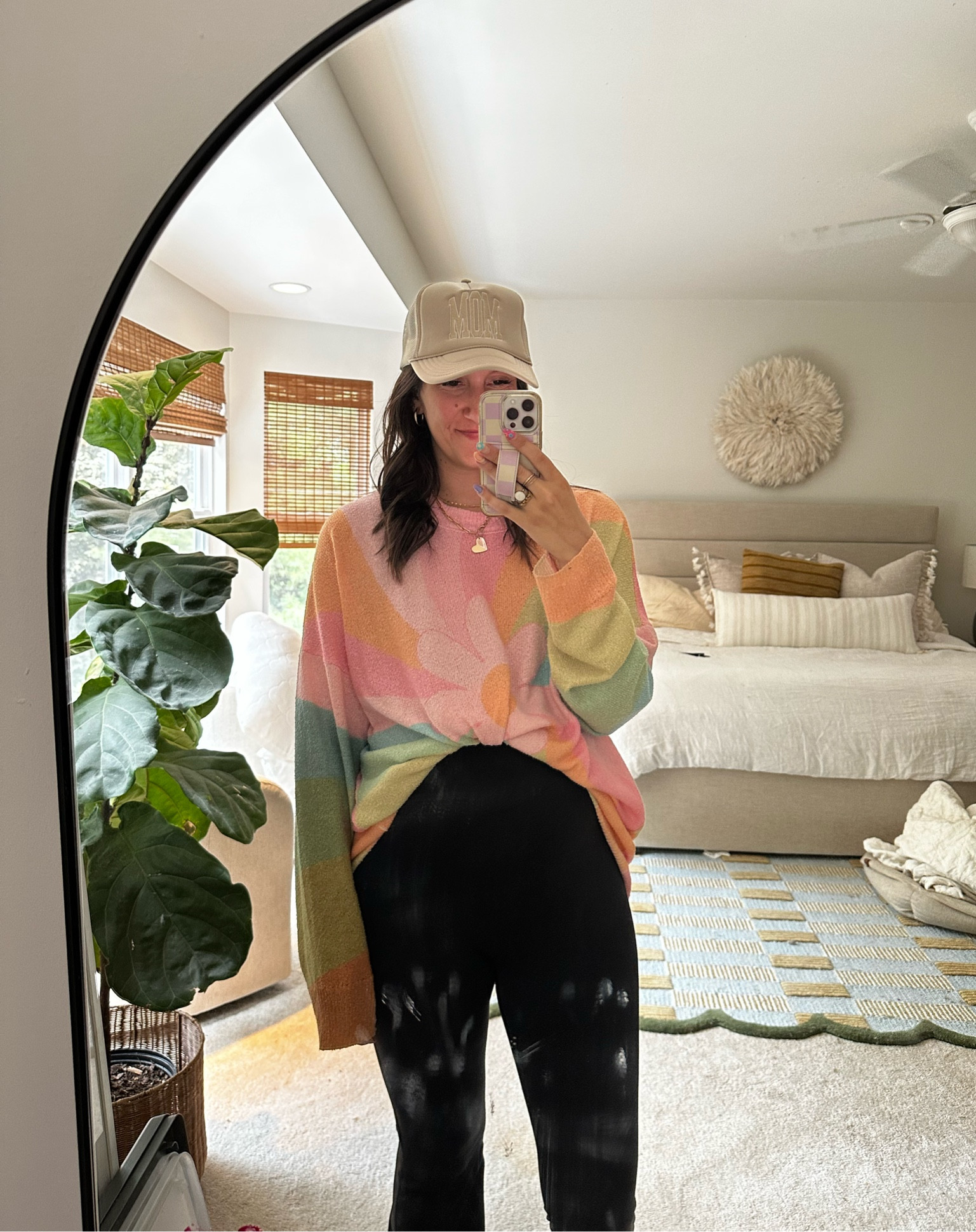 Getting use out of this target flare jumpsuit— if you’re pregnant, you won’t regret it! I have a size medium on.

Tied a light sweater over top. It’s a bit of a splurge but I use as a cover up for suits as well! For now I just tie over top of the bump with skirts/dresses/jumpsuits- size medium here. 

Hat is Riff Raff and I think KARRIE or KARRIE10 works! 