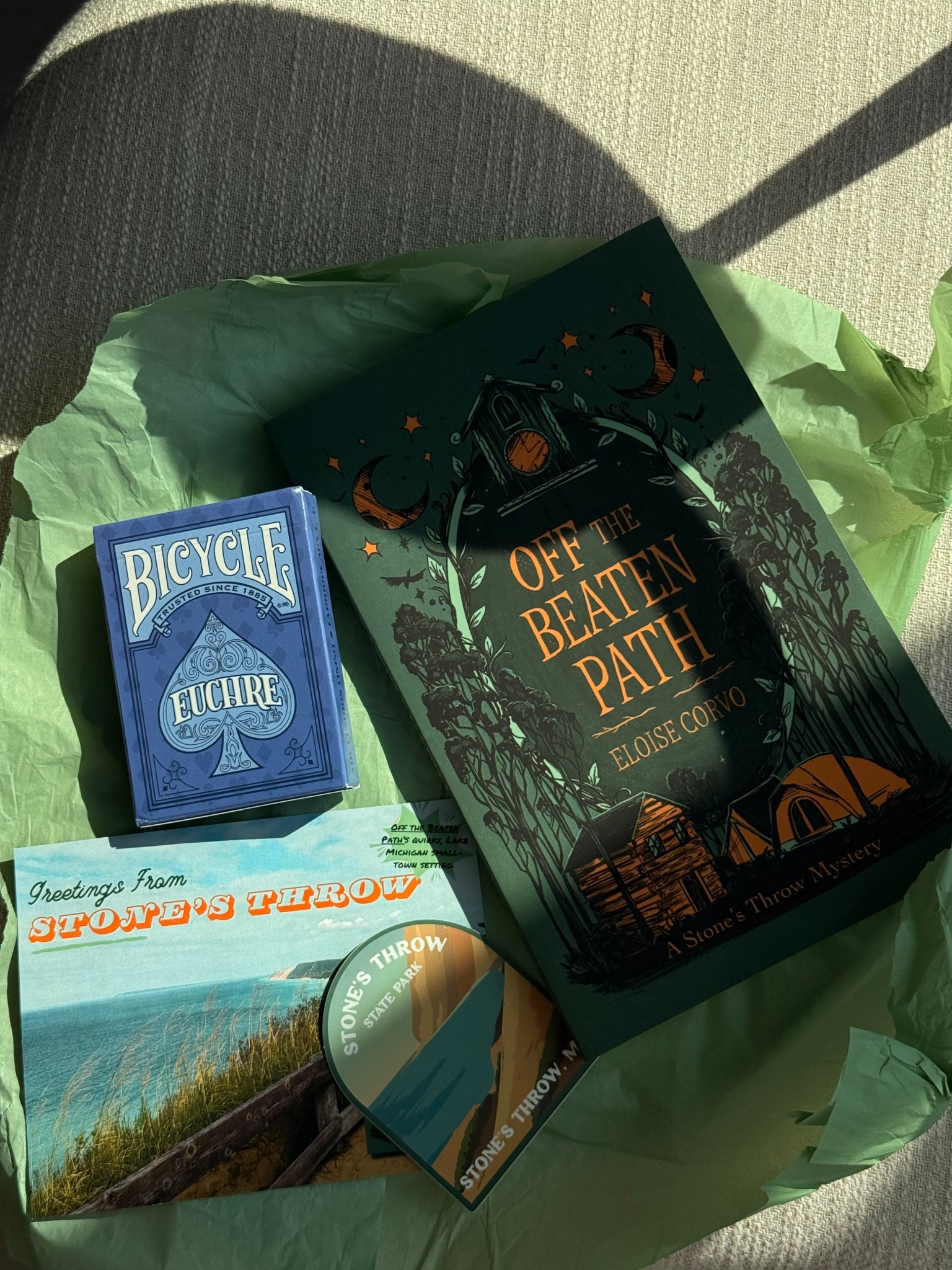 Stone’s Throw State Park Ranger Maudy Lorso spends her days playing cards and sipping drinks with her millennial gal pals, hiking steep sand dunes with her scruffy dog, Martin Short, and trying to ignore the pain of a recent, devastating breakup. After building a quiet life in the Lake Michigan coastal village of Stone’s Throw, Maudy’s emotional safety net is turned inside out when her boss informs her of looming budget cuts that threaten to permanently close the park—and eliminate her job. Determined to prove the park’s value, Maudy throws herself into organizing a successful campground opening weekend, just one week away. But when the body of a missing tourist is discovered in the park, her hope of saving Stone’s Throw State Park quickly begins to fade. In order to save her dream job and maintain her quirky, quiet life, Maudy jumps in to solve the murder of the dead man.

By Eloise Corvo

#booktok #indieauthors #debutnovel 

#LTKFindsUnder50