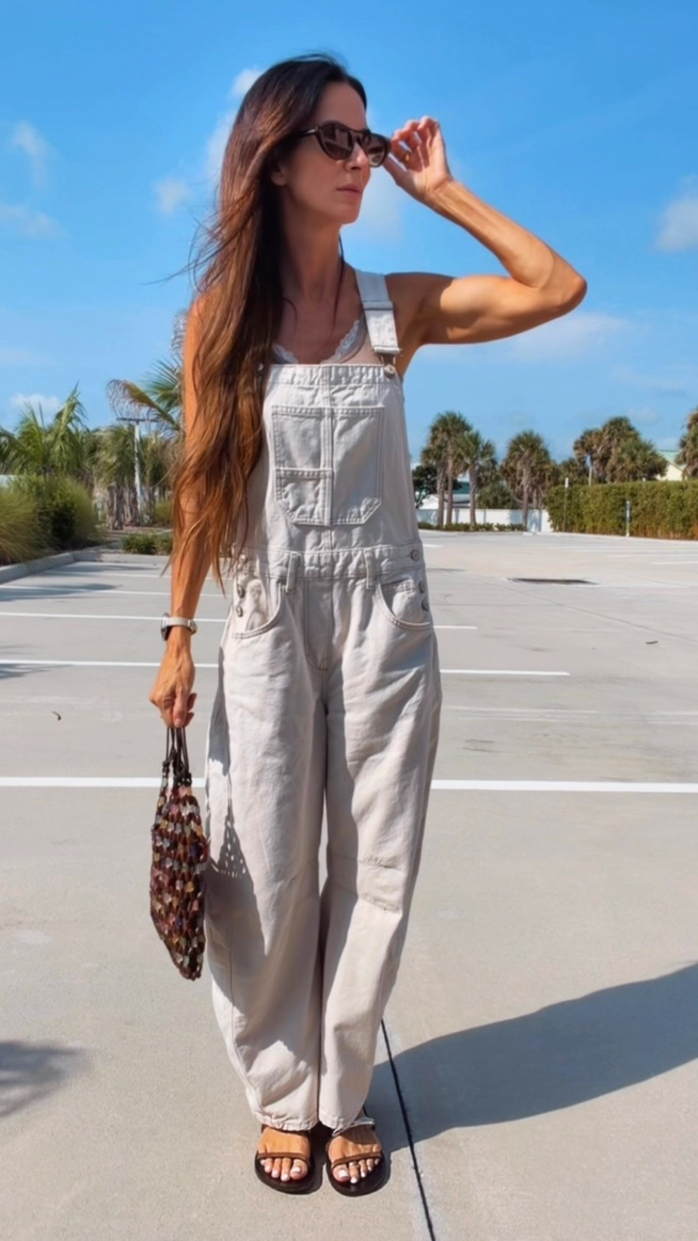 Some outfits just do all the work for you. 🤍

These barrel overalls are giving effortless, and this beaded bag is the little pop that makes the whole look feel extra fun. Throw on a lace tank, comfy sandals, oversized sunnies, and suddenly running errands feels like a fashion moment.

Proof that casual doesn’t have to be boring. ✨

#OOTD #SummerStyle #CasualChic #OverallsStyle #NicoleColeeStyle

#LTKdayinmylife #LTKgrwm #LTKootd