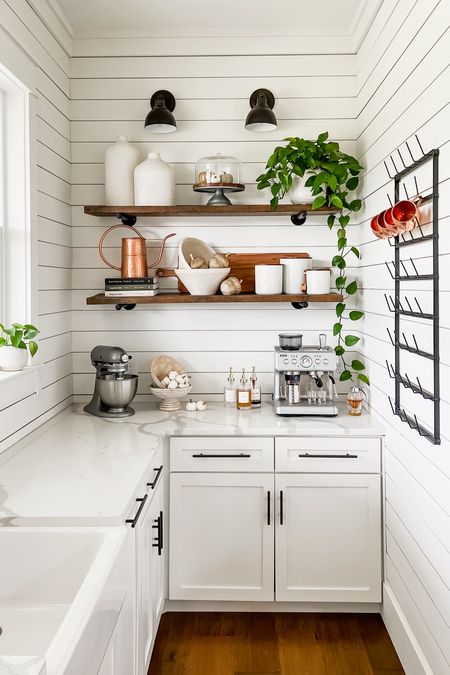 Kitchen coffee bar fall decor vases open shelving wall sconce lighting canisters paper mache bowls espresso machine syrup bottles countertop appliances watering can gold accents wood board charcuterie Halloween and fall styling 

#LTKSeasonal #LTKstyletip #LTKhome