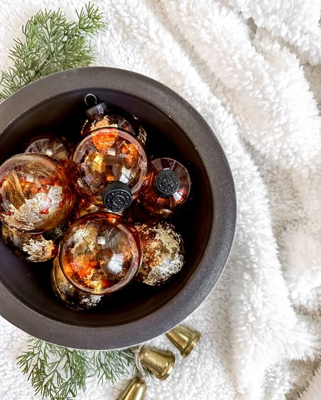 Makes these easy DIY faux amber glass/tortoise shell ornaments using plastic ornaments from dollar tree or Michaels. 

I’ve seen a lot of tutorials to make these.  Most of them tell you to paint the inside.  FYI, that is very difficult and very messy and takes forever to dry.  After lots of trial and error I’ve found that the easiest way is spot painting, or dripping, alcohol ink, all over the outside of the ornaments.  Alcohol ink is completely transparent and very easy to work with.  There is very little dry time and you can layer it as much or as little as you want!

I made these ones that exact way and then I added gold rub n buff and some gold leaf to a few of them for a gilded look!

These turned out, super pretty and look like they come from a high-end store! #ltkdiy #diy #holidaydiy #christmas

#LTKHoliday #LTKunder50 #LTKSeasonal
