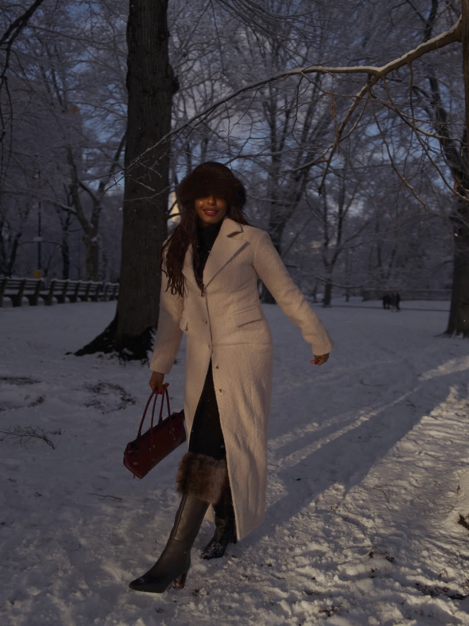 Walking in a winter wonderland ☃️ snow day but make it chic! Wearing the cutest faux fur accessories (hat and fur trim knee high boots), warm cream coat and heat tech layers from Uniqlo along with burgundy Michael Kors bag. Such a cute winter outfit idea! … For more links to stocking stuffers, makeup bag, snow boots, holiday party dress finds, follow me on LTK! ✨

#LTKHoliday #LTKootd #LTKSeasonal