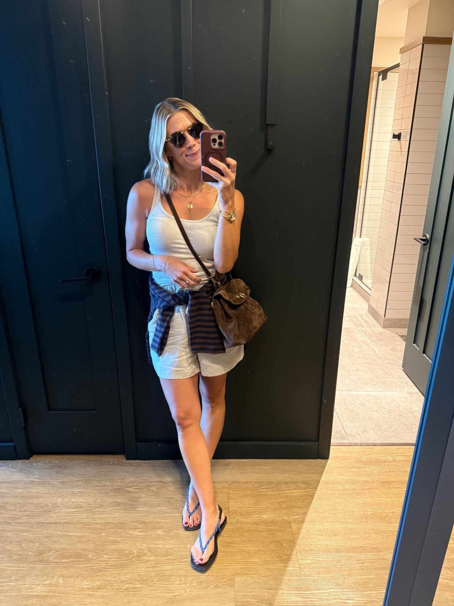 Wearing small shorts, xs tank, small striped long sleeve, sandals tts