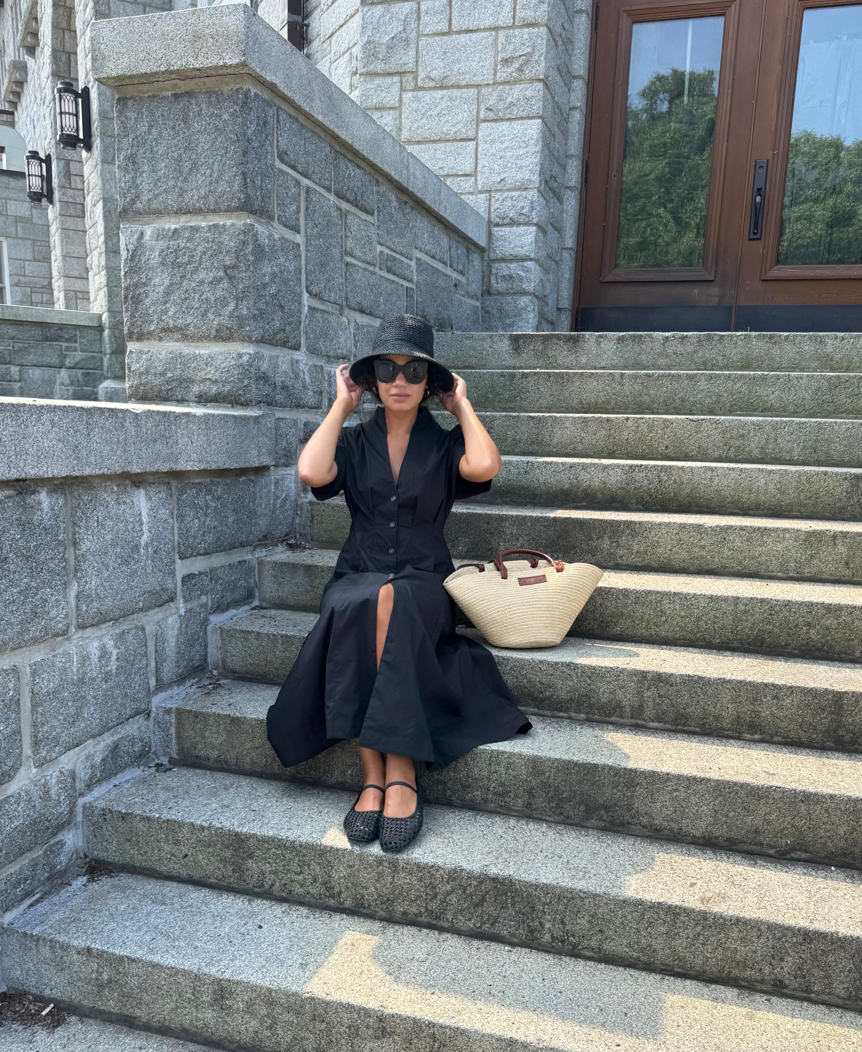 Classy summer style: black shirt dress, woven flats, straw bag, and straw hat 

#LTKStyleTip #LTKSeasonal