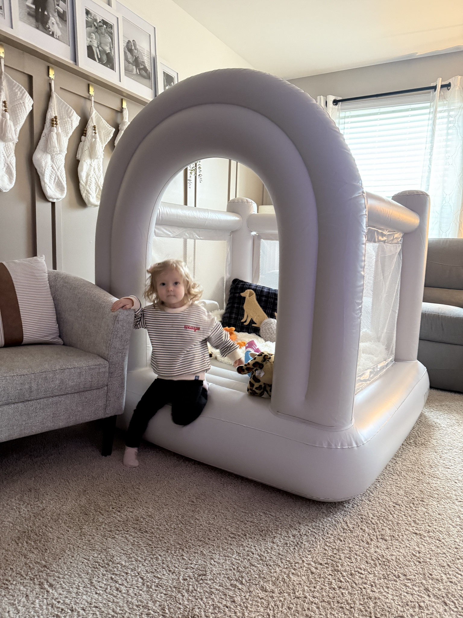 We’ve had this bounce house set up in our living room since Christmas Day. You inflate it once with the built in pump, plug it and it’s set until you’re ready to put it away. And it’s light and neutral so you don’t get sick of looking at it so quickly!

#LTKFindsUnder100 #LTKKids #LTKmomlife
