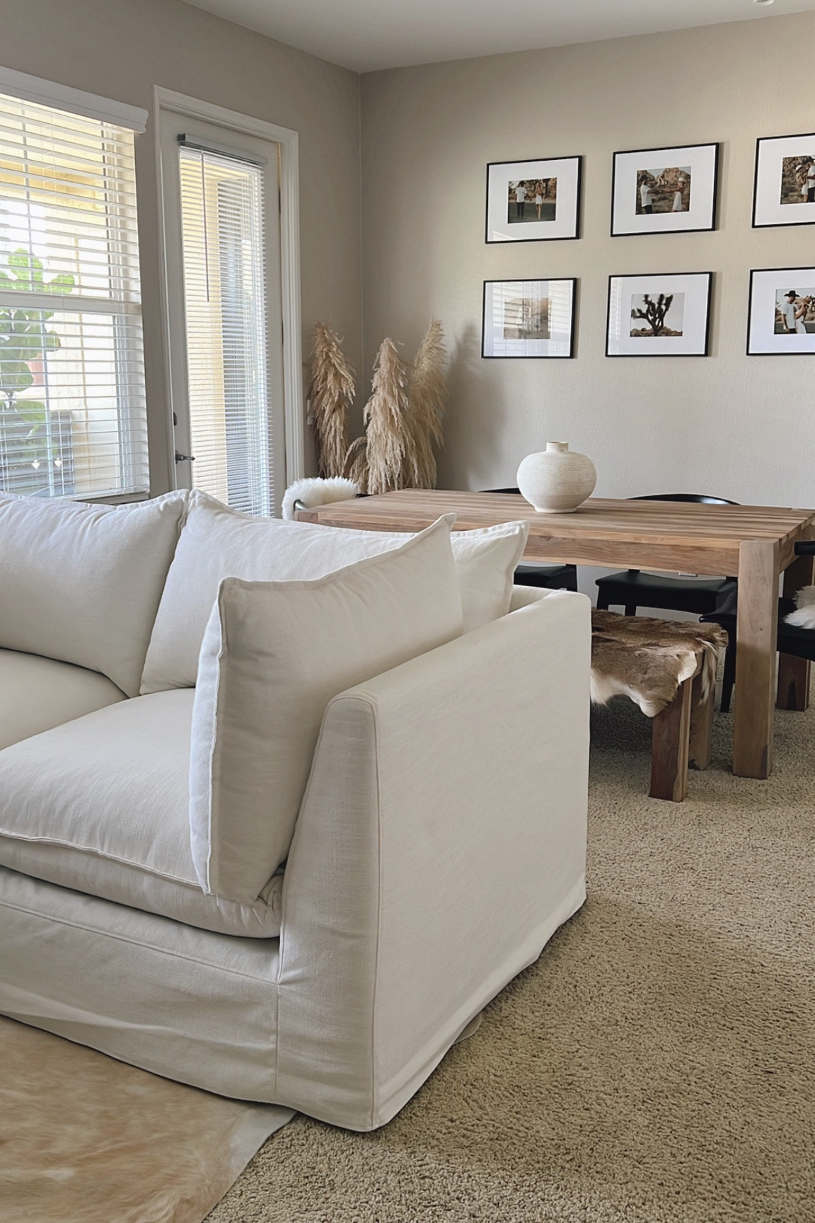 Neutral living & dining room 🤎

We are loving our Bleeker sofa in alabaster performance linen from West Elm, it adds the perfect touch of organic to our space! 

#modernorganichome #neutralhome 

#LTKhome
