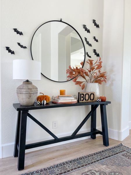 Spooky entryway with bat decals 
(Our exact table linked, I painted ours Tricorn black, similar black console also linked for you!)

#LTKHalloween #LTKhome #LTKSeasonal