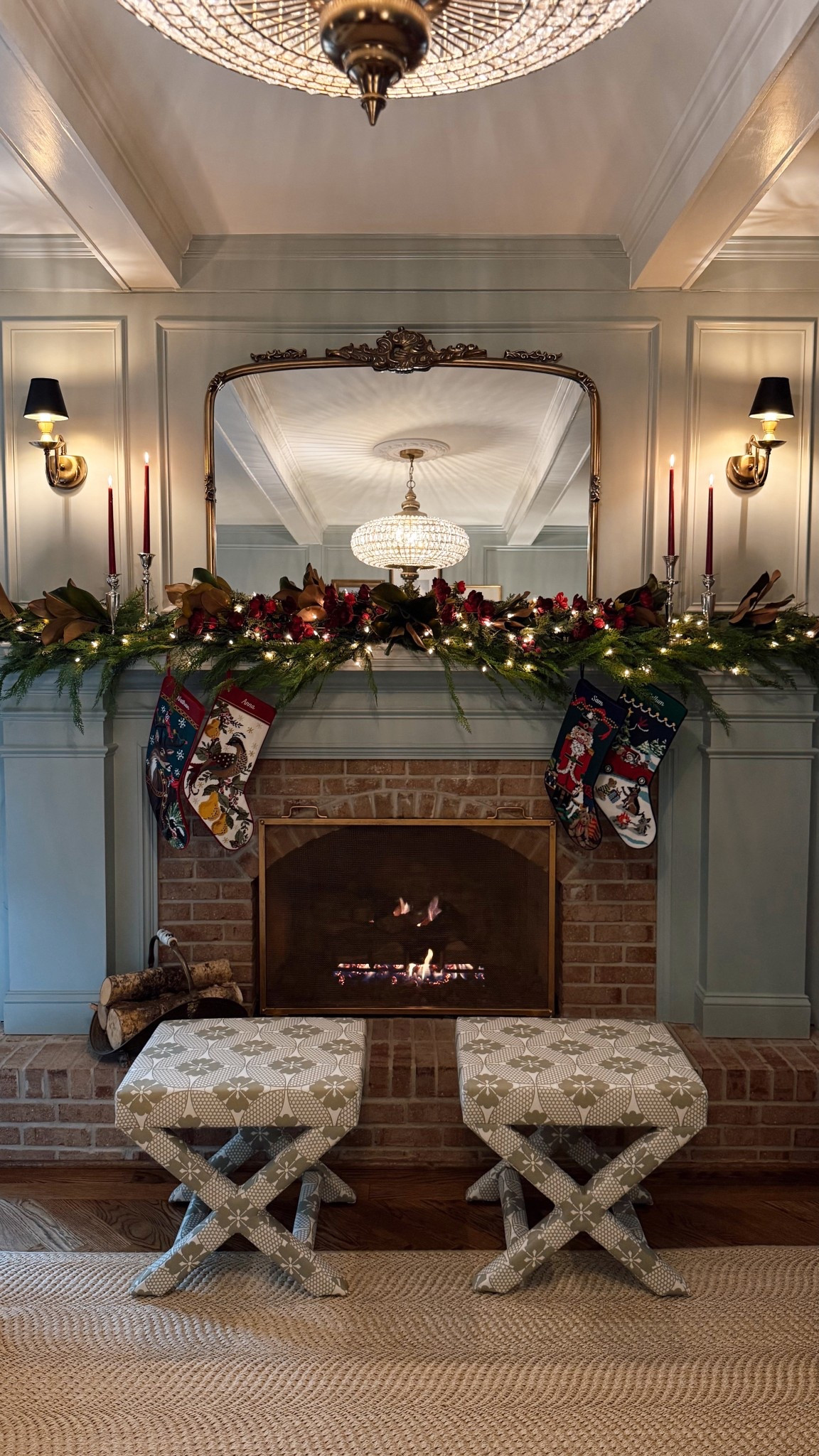 Christmas mantle featuring the sweetest needlepoint stockings! 