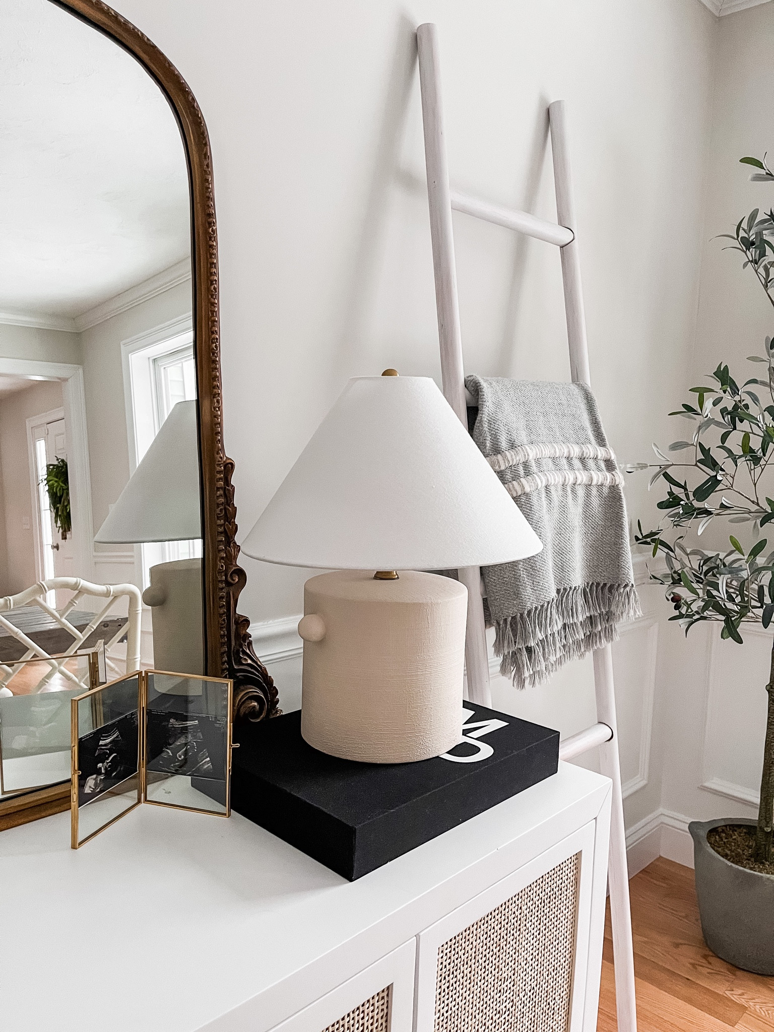 Cozy dining room nook with a mcgee and co. Studio mcgee target table lamp, coffee table books and anthropologie primrose mirror 

#LTKunder50 #LTKunder100 #LTKhome