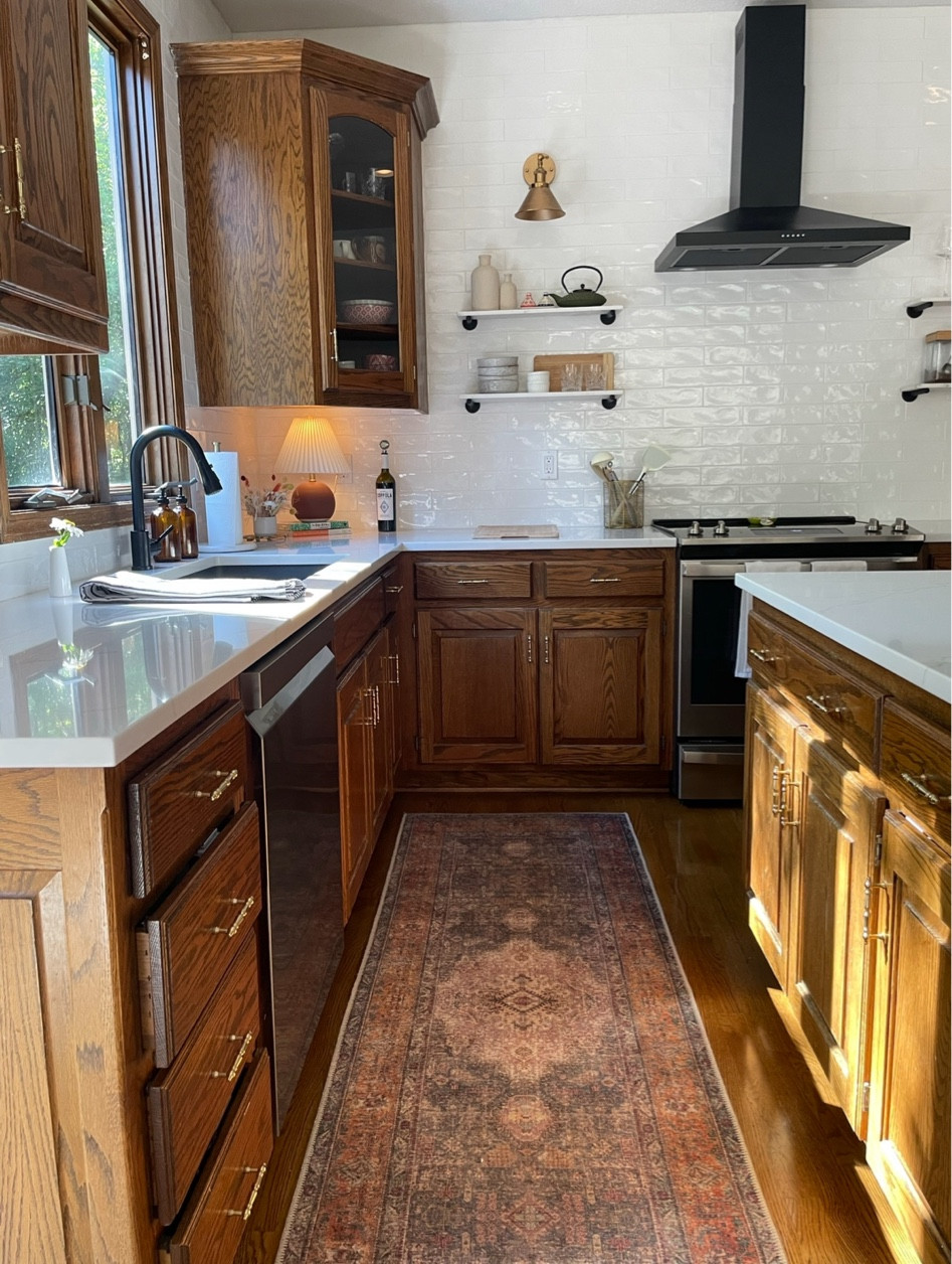 A great runner rug to compliment our oak cabinets! Included the brass hardware and our favorite countertop lamp as well. 

#LTKHome