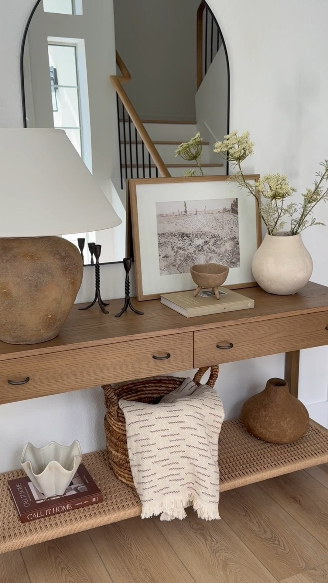 Entryway styling: warm neutrals, earthy decor and textures. 

Console table, earthy lamp, arched mirror, vases, organic modern decor  

#LTKU #LTKHome #LTKStyleTip