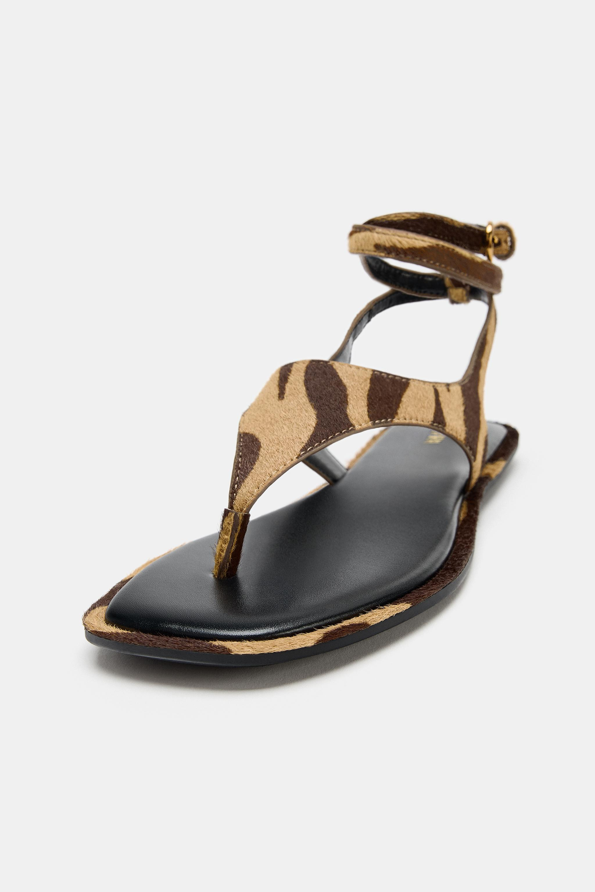Flat sandals. Animal print leather with fur effect. Front toe-loop strap. Crisscross ankle straps... | Zara US