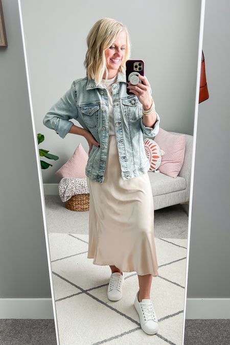 Slip skirt styled with a denim jacket and white sneakers. This is one of my favorite ways to wear a slip skirt  

#LTKstyletip #LTKfindsunder100 #LTKSeasonal