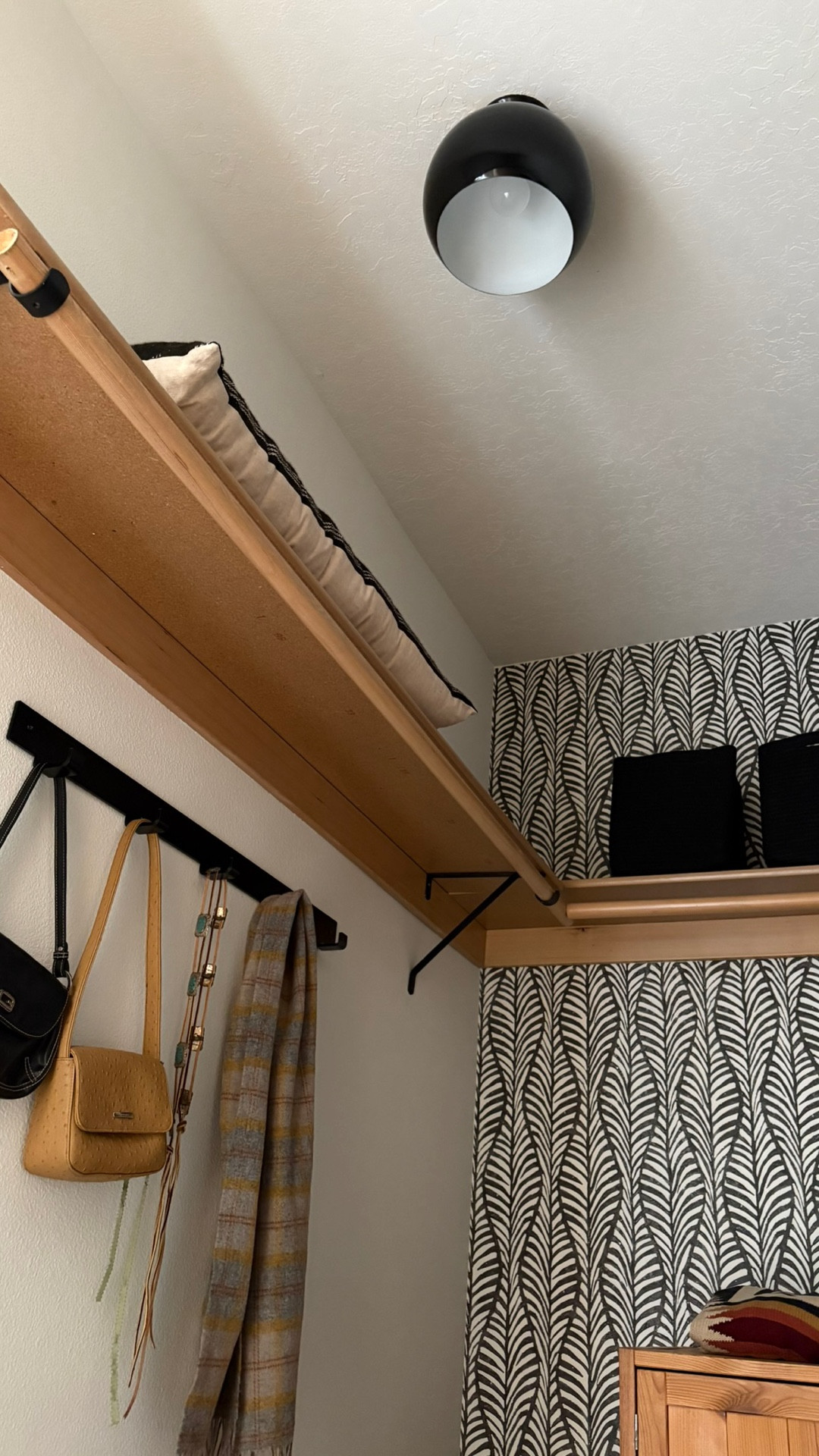 I love these black baskets, especially against the botanical black-and-white wallpaper. Their rope so they’re soft and flexible to hold things. I keep my sheets and bedding in here.

#LTKHome