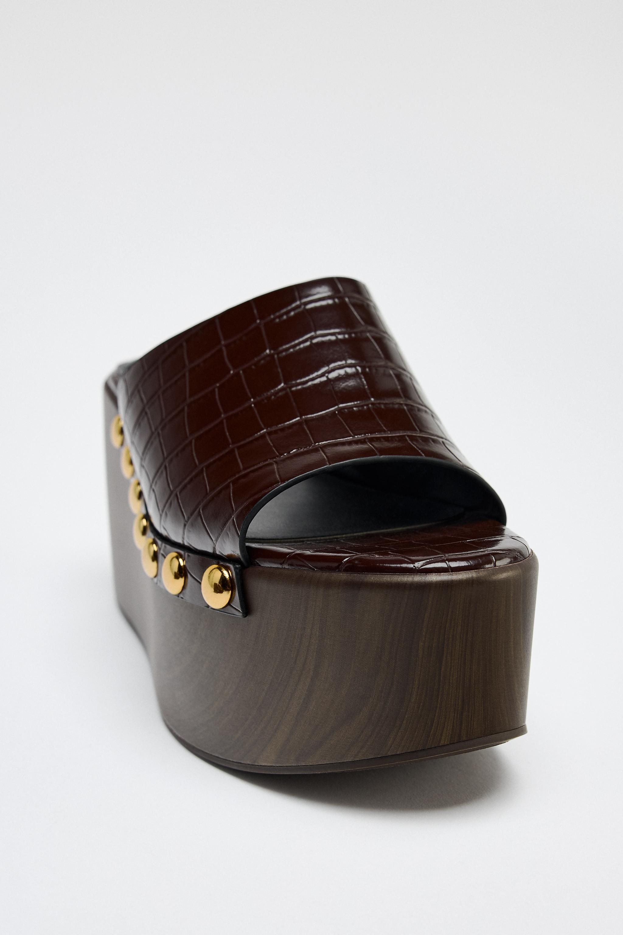 Embossed wedge heel mules. Studded detail on the sides. Platform sole. Round toe.Wedge height: 3.... | Zara US