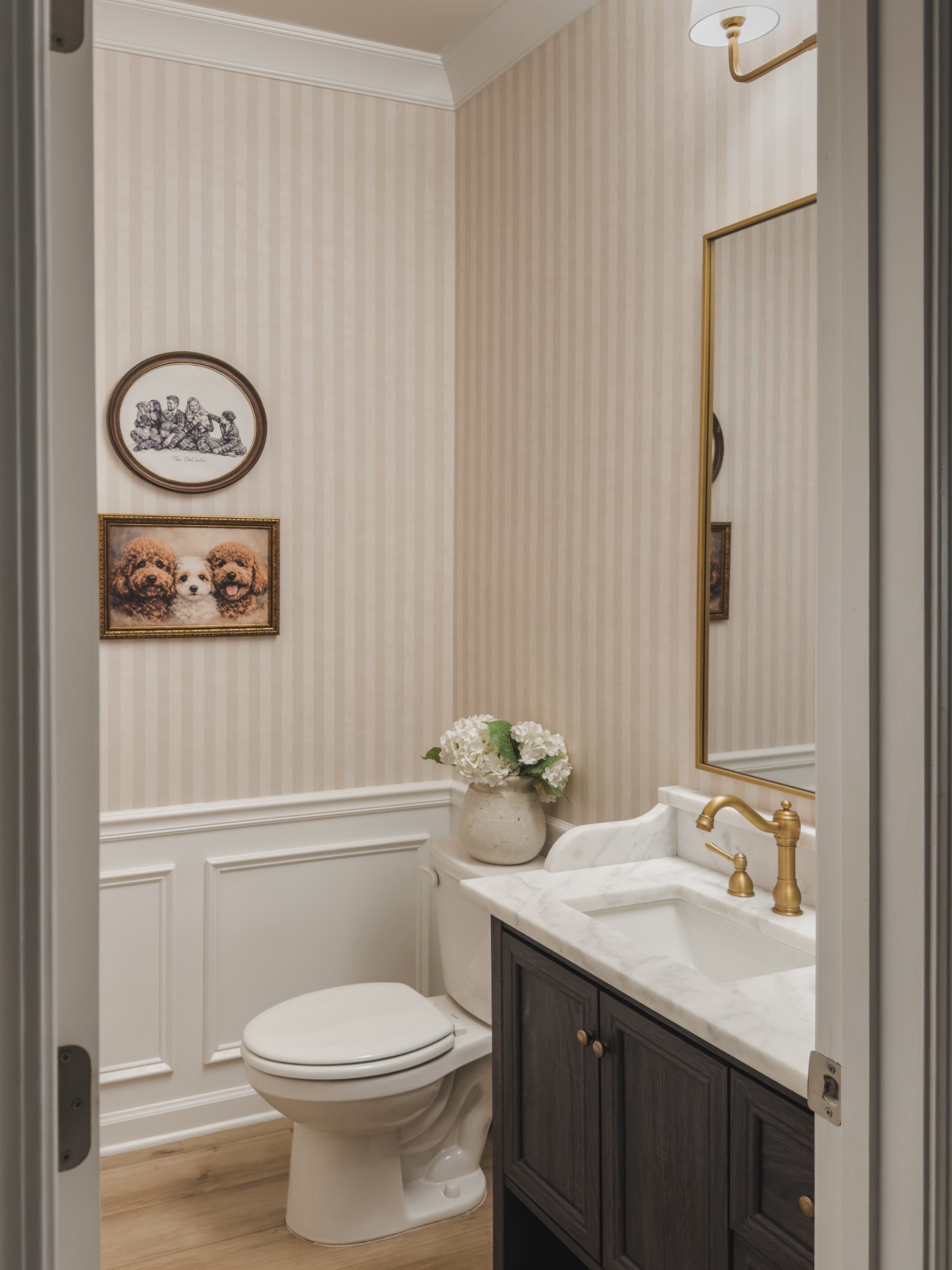 Powder bathroom transformation! We added picture frame molding and the prettiest beige striped wall paper from @walls_republic : Beige Simple Stripes Wallpaper R8771

#LTKSaleAlert #LTKFindsUnder100 #LTKHome