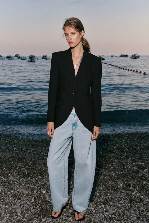 Blazer with a collarless neckline and long sleeves with shoulder pads. Featuring front flap pocke... | Zara UK