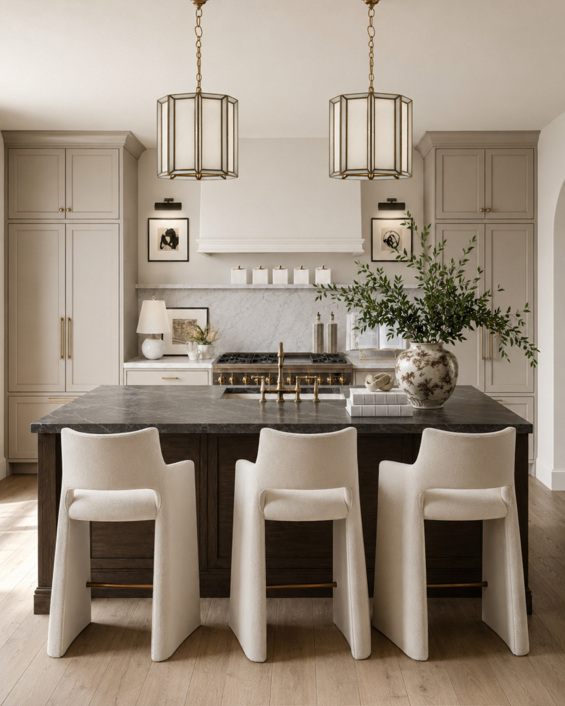 A warm, layered kitchen look with creamy upholstered counter stools, antique brass accents, dark wood tones, marble-inspired surfaces, and classic lantern pendants. Proof that a kitchen can feel polished and expensive without feeling cold.

I may receive a commission from items purchased through my links. 

 #LTKHome