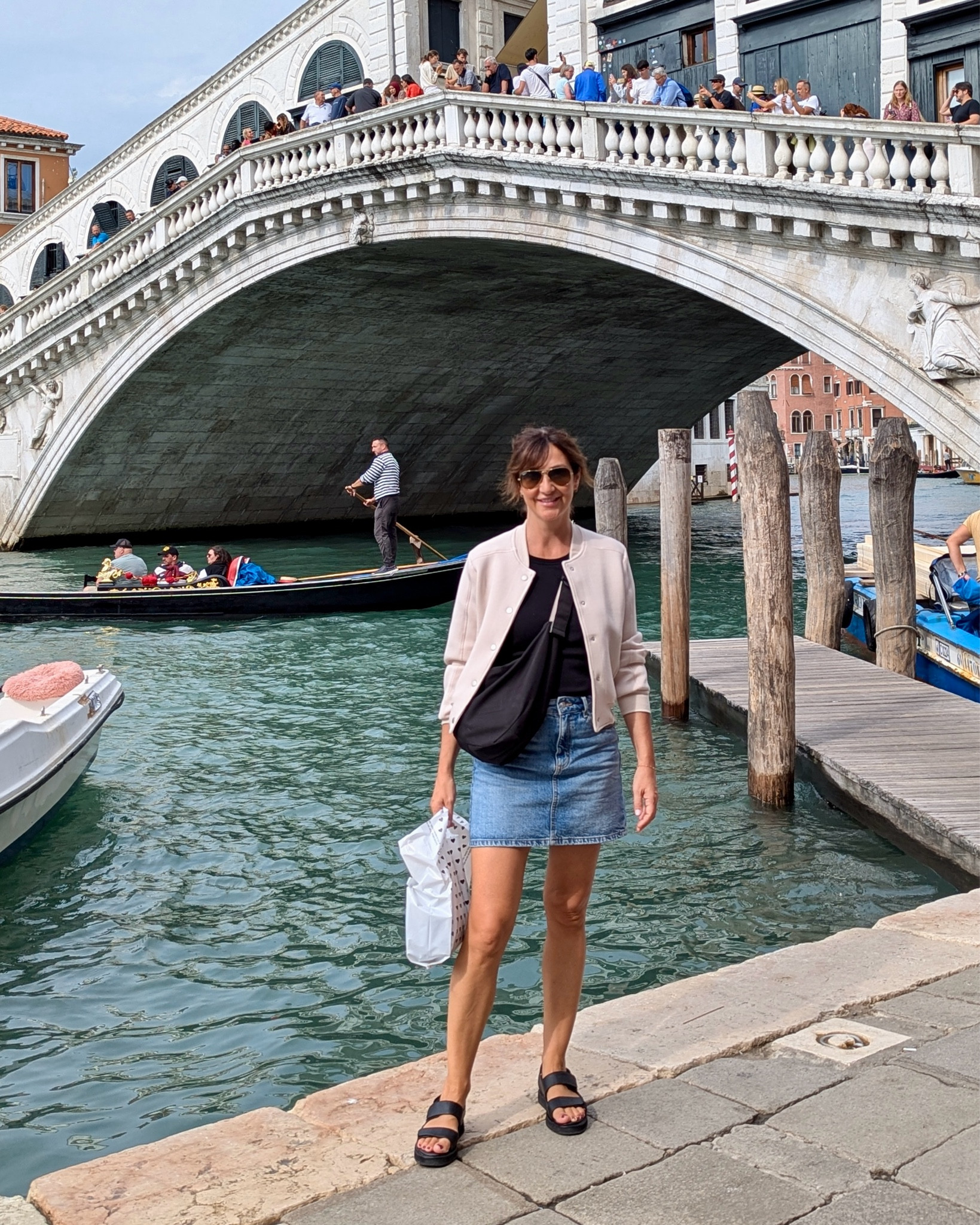 Exploring Venice outfit! Layers are a must and this jacket is perfect cause it’s really soft and stretchy, easy to tie around your waist or shoulders. I sized down to XS, my usual small fit fine too but was more of an oversized fit. 
Wearing my usual S in the skirt.
Sized up to M in the tank top, it has a built in bra and the band felt more comfortable on the M.
Sandals are pricy but such good quality and really comfortable.
Also linked by bag and sunnies 


#LTKShoeCrush #LTKTravel #LTKStyleTip