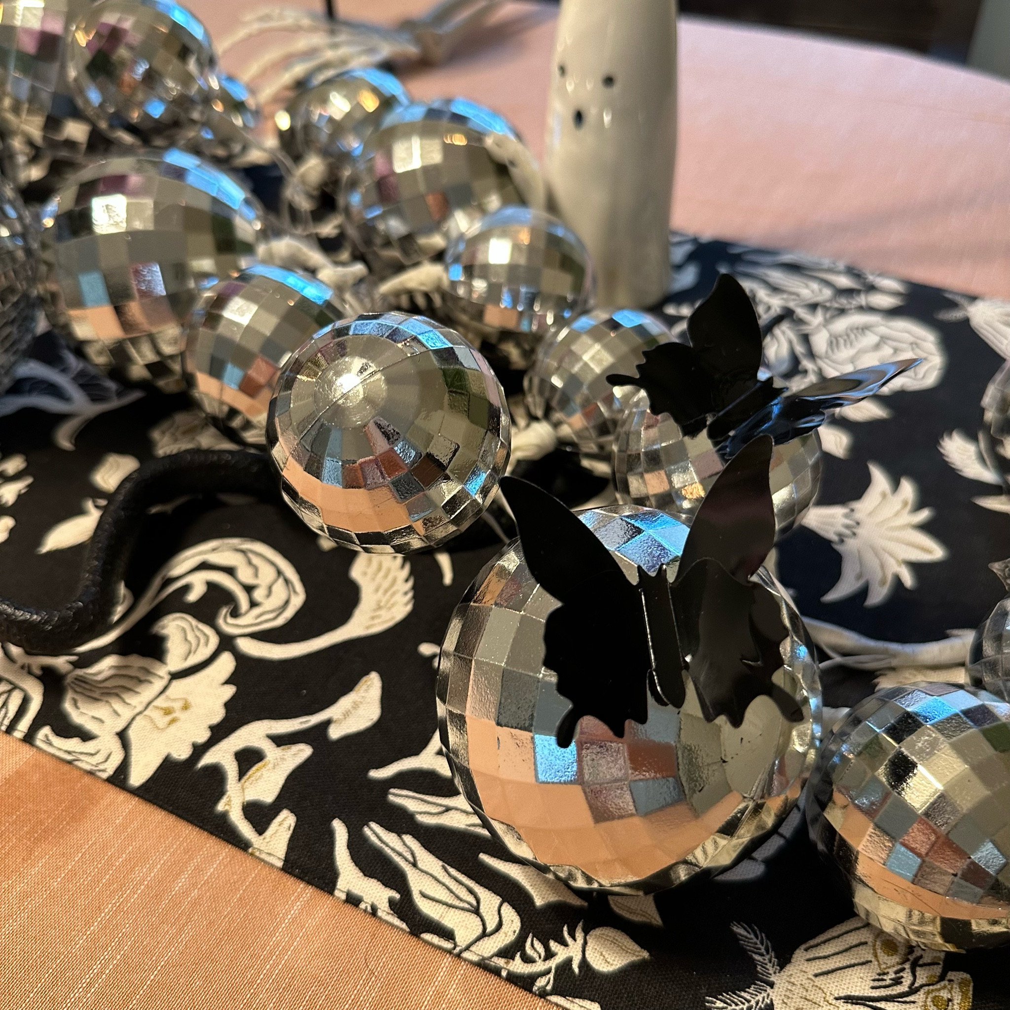 Disco ball garland as a Halloween centerpiece 

#LTKHoliday #LTKSeasonal #LTKHalloween
