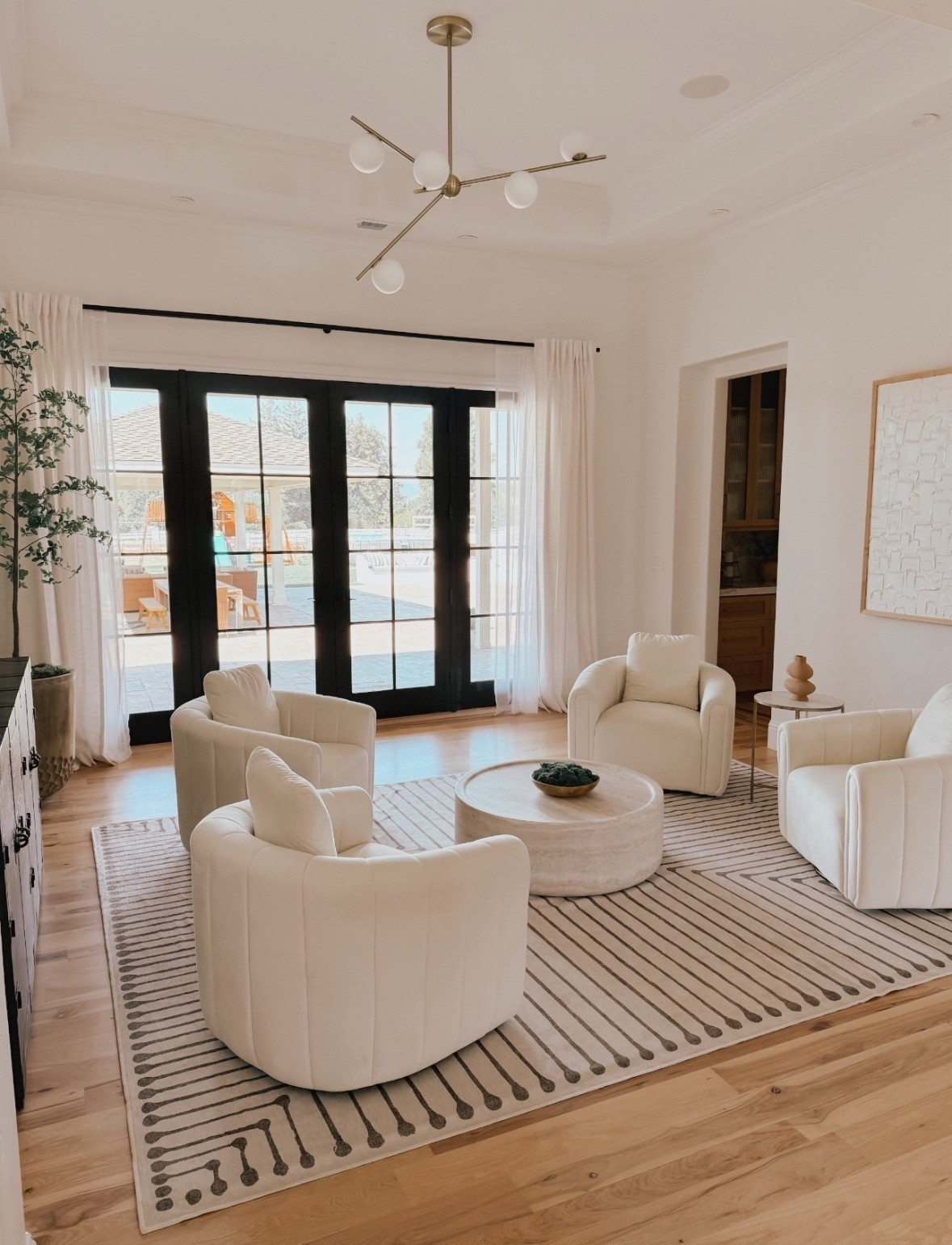 Formal living room with swivel barrel chairs perfect for conversation and gatherings 


#LTKHome #LTKU