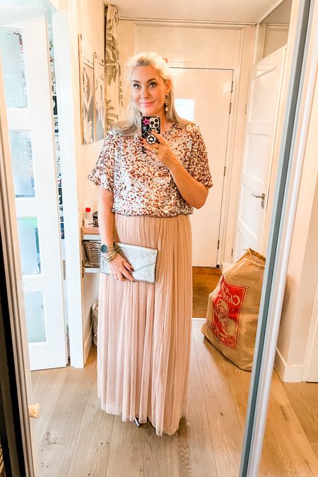 Ootd - Monday (Christmas). Shopped my closet for this Christmas look. Wearing an old pink sequin top and a tall maxi rule skirt. Silver heeled booties and a silver clutch. 

#LTKgift 

LTKFestiveSaleNL #LTKparties #LTKHoliday