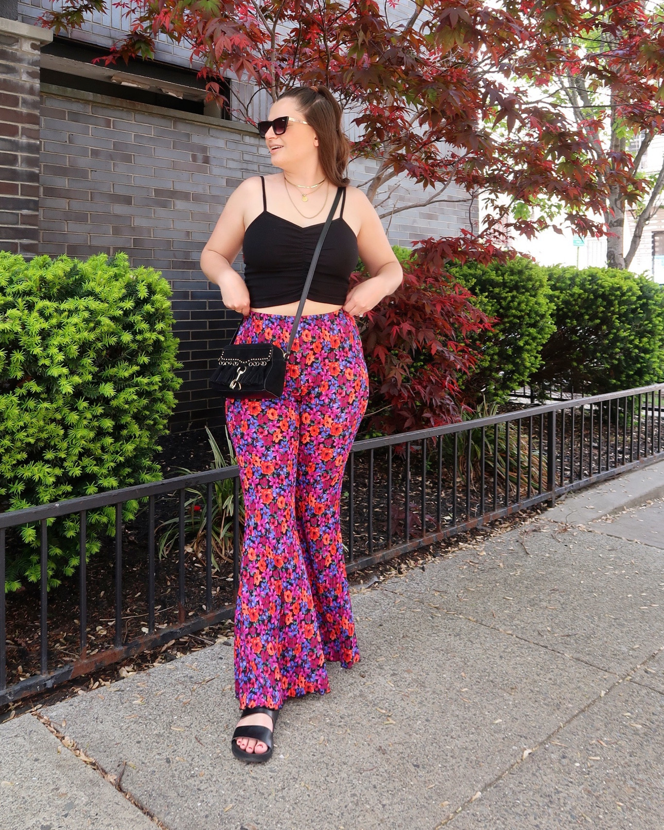 An easy spring outfit idea - flare pants and a tiny tank top! I love the floral print on these and kept all black accessories to ground the look  

#LTKSeasonal #LTKunder100