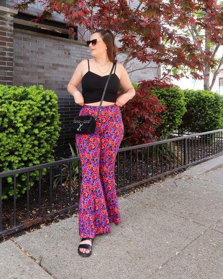 An easy spring outfit idea - flare pants and a tiny tank top! I love the floral print on these and kept all black accessories to ground the look  

#LTKSeasonal #LTKunder100