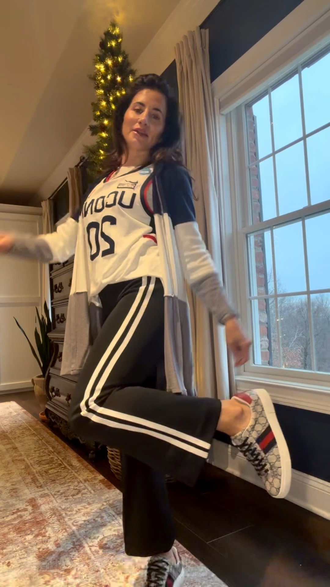 OOTG 1/10/26 Jersey Day 🏀2️⃣0️⃣💙

Sweater // Fanatics Uconn Cardigan (not currently available) 

Jersey // Uconn Men’s basketball Andrew Hurley Jersey 
link : https://www.truegether.com/listing.html?id=USER.49fcb201-e463-4ed6-ae05-9b1a730a33df&fbclid=PAdGRleAPvKRFleHRuA2FlbQIxMQBzcnRjBmFwcF9pZA8xMjQwMjQ1NzQyODc0MTQAAaeZ2mwKElLKFf_aWO3VcT97hgnzwgocCFKvrfgO25uIRRKkQfQ_pa6jKyzyKA_aem_wEs7DQ7uS5jhRzX9sfnq-A#google_vignette

Pants // Anthropologie maeve fitted track pant (currently unavailable , similar style linked) 

Sneaks // Gucci ace sneaker with web in beige and blue supreme 

#LTKgrwm #LTKootd #OOTG #Gamedaylook #anthropologie #gucci #fanatics #uconnhuskies 