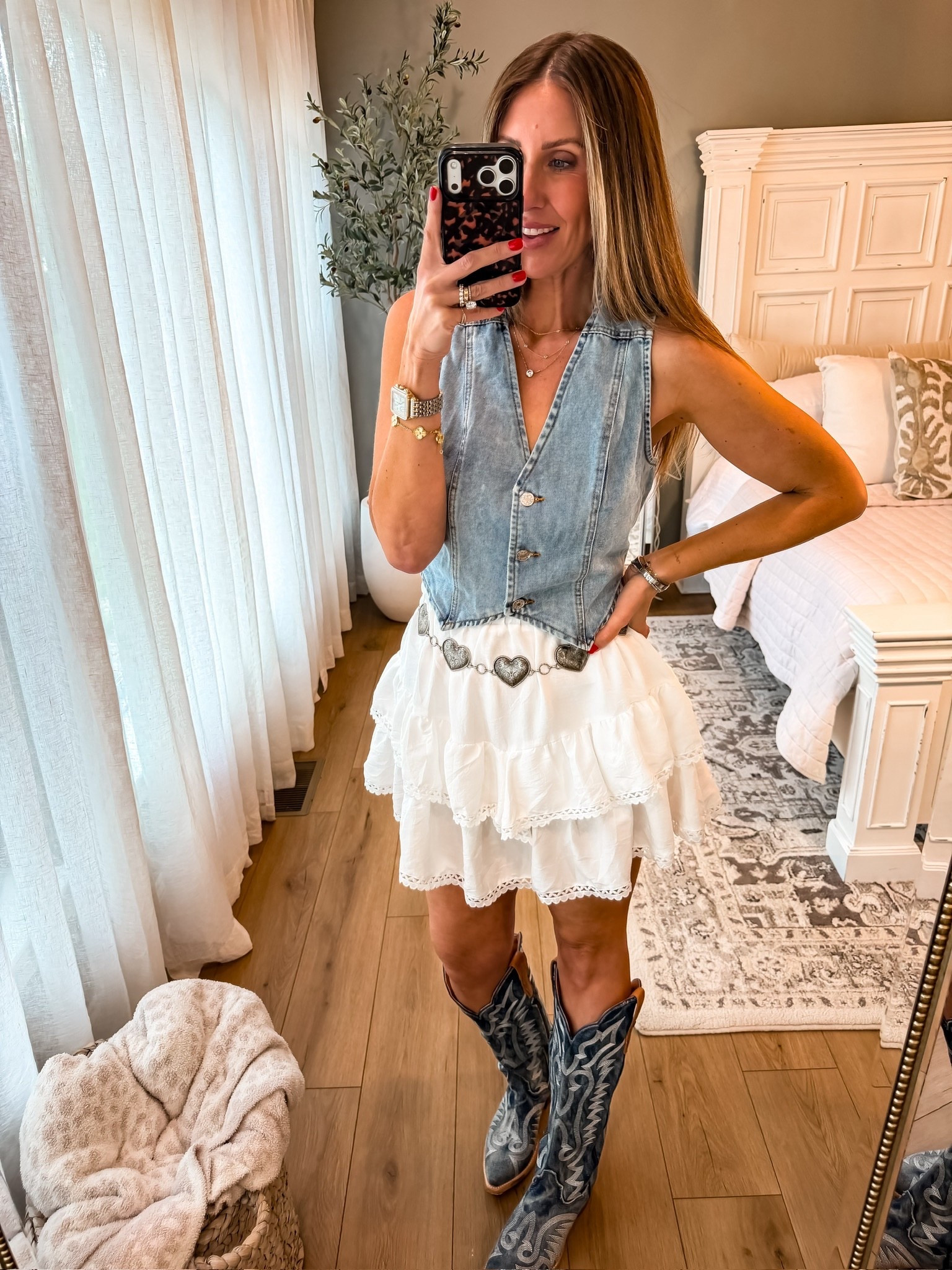 Okay this might be my favorite western look yet 🤍 The denim vest with this flowy white skirt is such a good combo, and the boots + belt pull it all together. Feminine but still has that edge

western style, denim vest, cowboy boots, summer outfit, feminine western, outfit inspo, themominstyle 

#LTKOver40 #LTKootd #LTKSeasonal