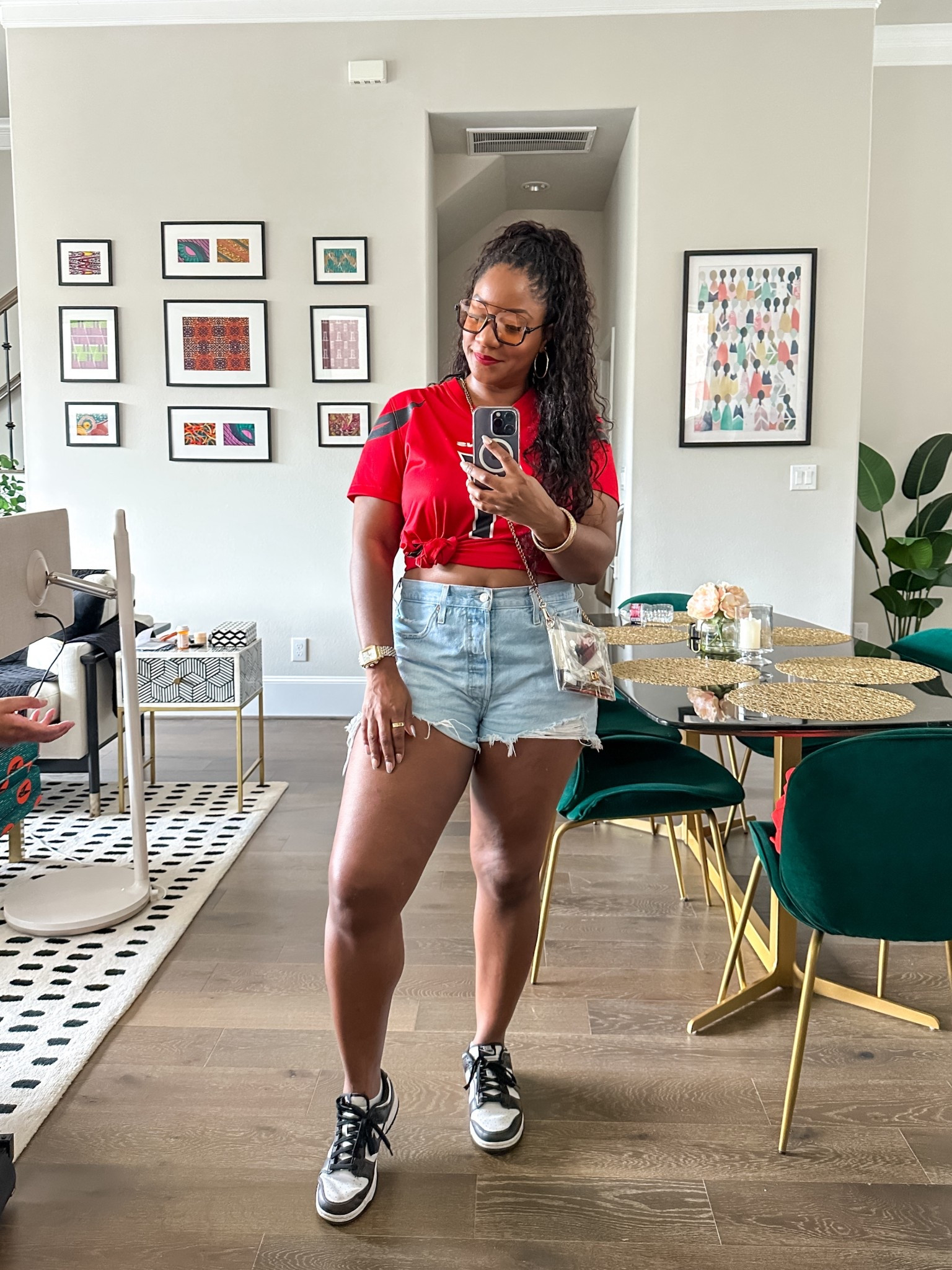 Game day ready! 🏈 I knotted my Texans jersey and paired it with distressed denim shorts, sneakers, and a clear crossbody bag (stadium-approved!). Casual, comfy, and still cute for cheering on the team.🤘🏾

game day outfit / Texans game outfit / NFL game day style / sporty chic look / denim shorts outfit / casual outfit with sneakers / stadium clear bag outfit / game day fashion / football game outfit / tailgate outfit ideas / cute game day outfit with sleeves