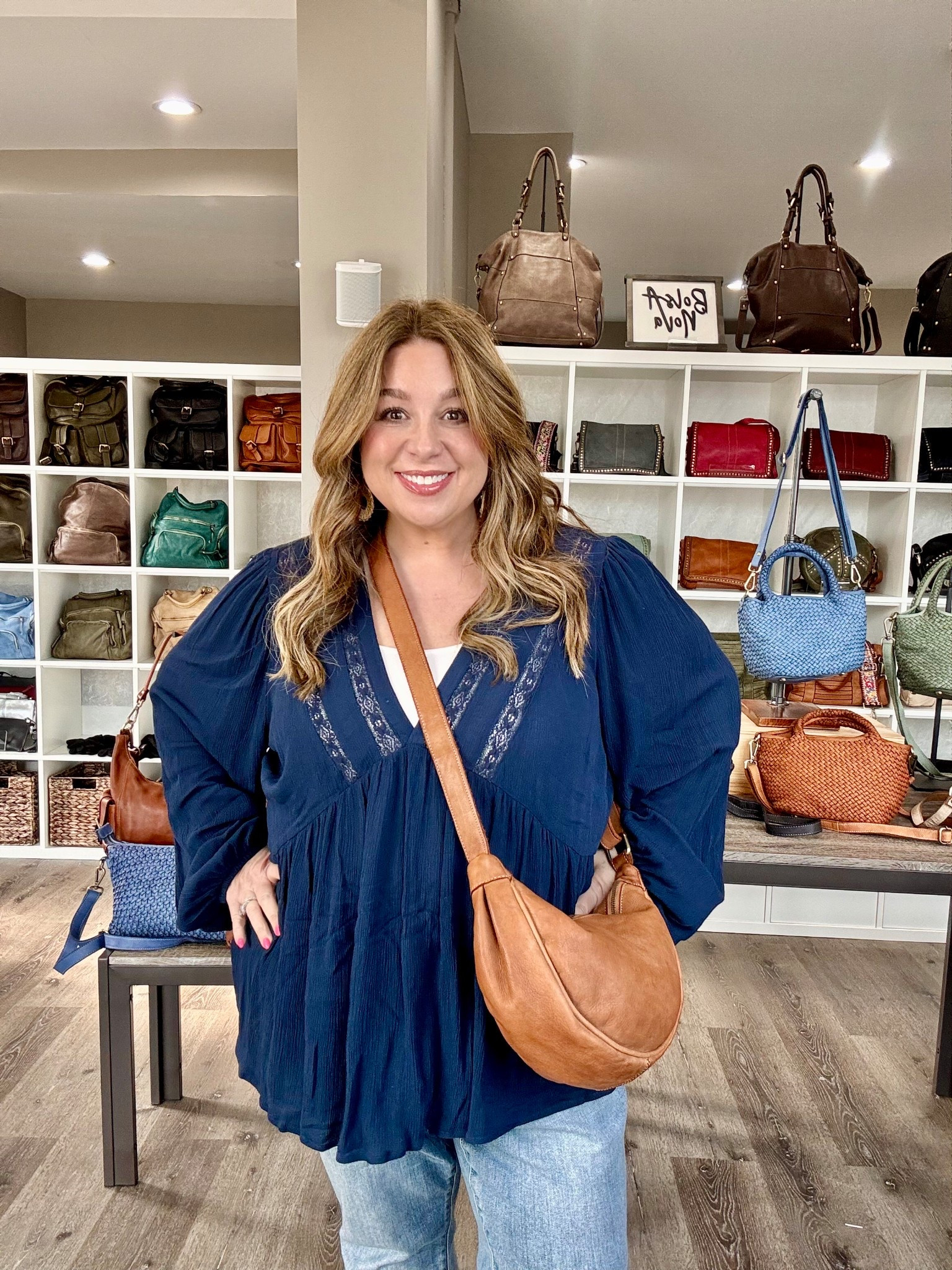 Hug Hobo from Bolsa Nova is my fav new bag! Also comes in black!  As you can see my shirt is much more low cut than it shows on the model.  I had to wear a tank under it.   I’m 5’2 for reference and I’m wearing a size 1.   Judy Blue jeans that are from last year.  

#LTKFestival #LTKStyleTip #LTKItBag