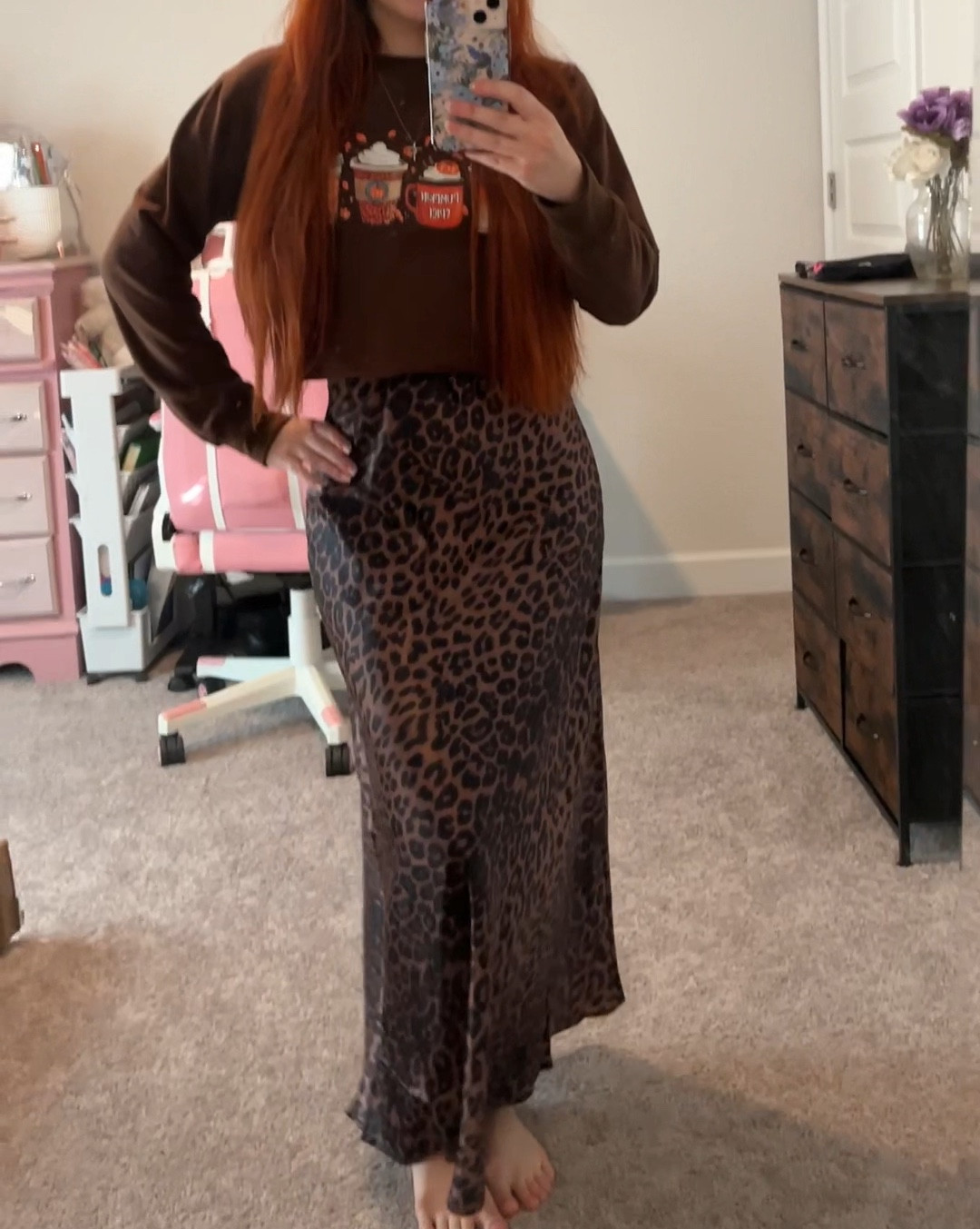 Leopard print satin skirt, definitely a fall and winter must have, paired with a fall themed sweatshirt 🍁🖤🤎🎃

#LTKStyleTip