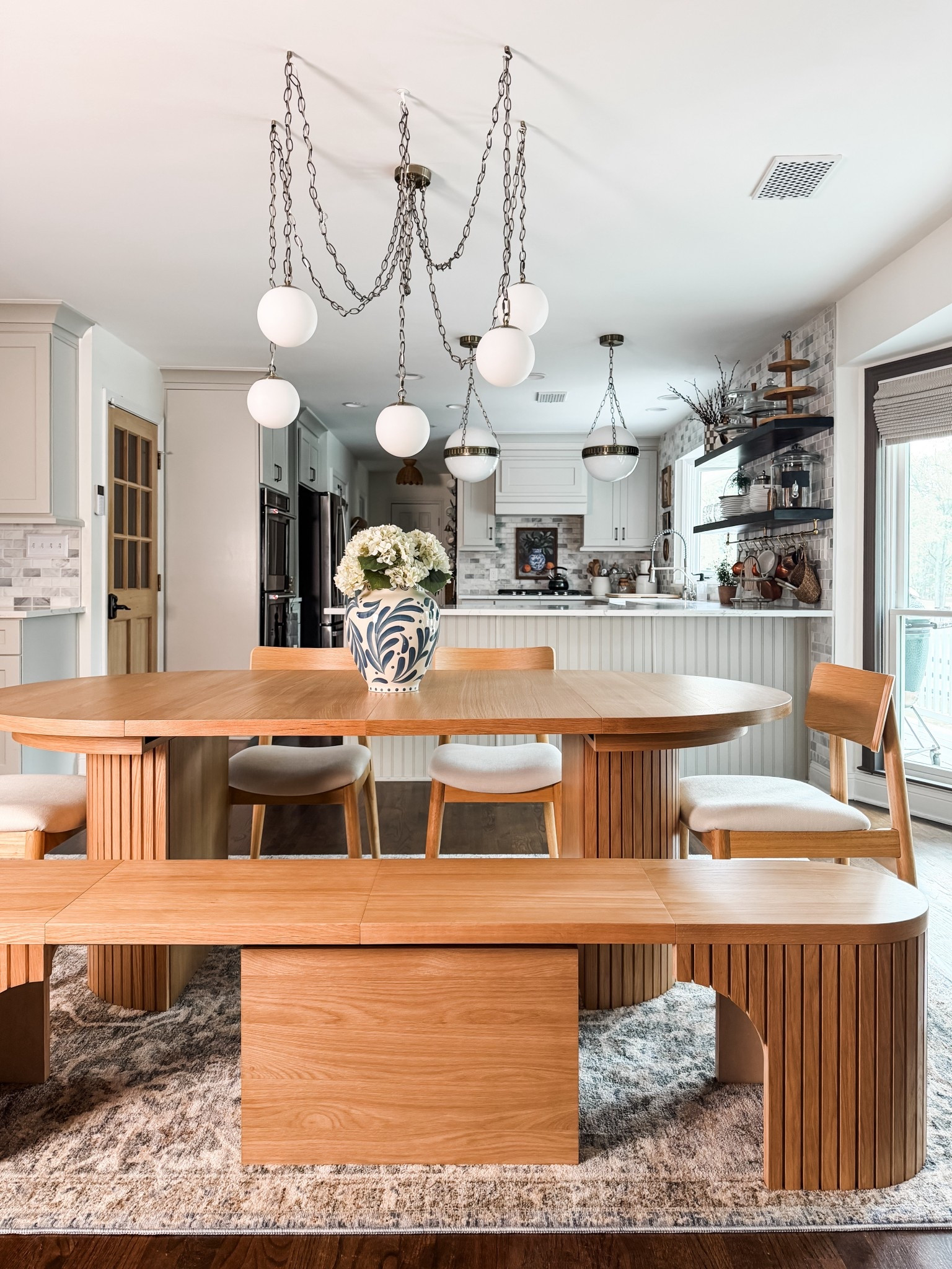 Somehow, this table manages to be both space-saving AND host-ready! The round-to-oval design means it stays cozy for everyday life, but expands for large gatherings. My favorite features include:

✔️ expands from round to oval
✔️ seats up to 10
✔️ solid wood construction that feels custom
✔️ comfortable seating 
✔️ extendable bench seating 

Code EANES100 = $100 off $2k+ Transformer Table purchase 

#transformertable #diningtable #vase #fauxhydrangeas #chandelier #pendants #diningroom 



#LTKHome