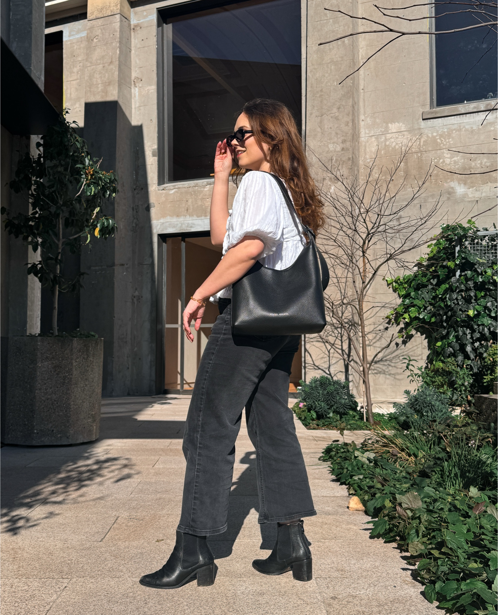 Brand new from Status Anxiety - the perfect medium sized black leather shoulder bag, and black oval sunglasses 🖤