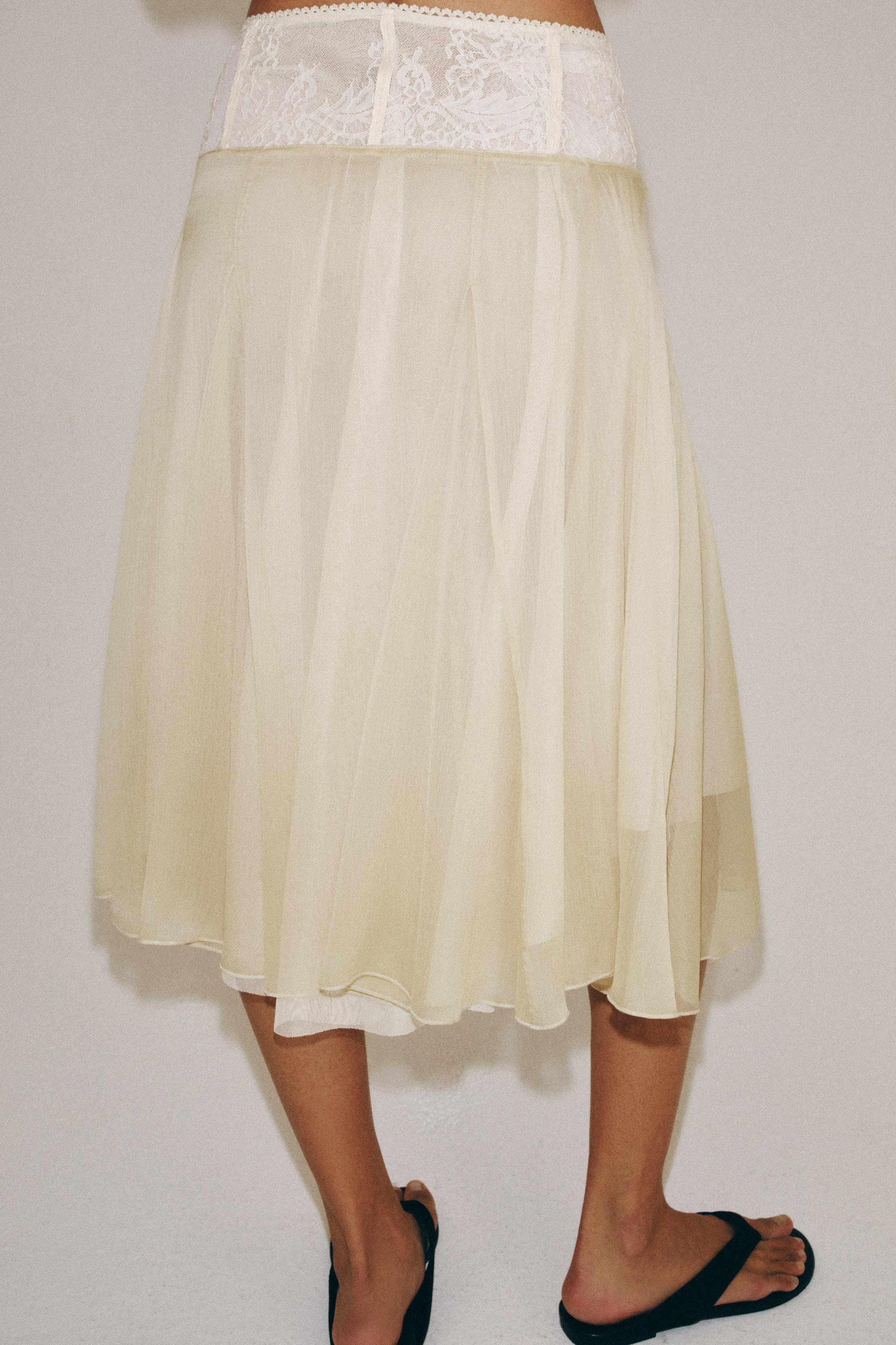 Model height: 178 cmHigh-waisted midi skirt with a contrasting lace waist. Interior lining. Tulle... | Zara Canada