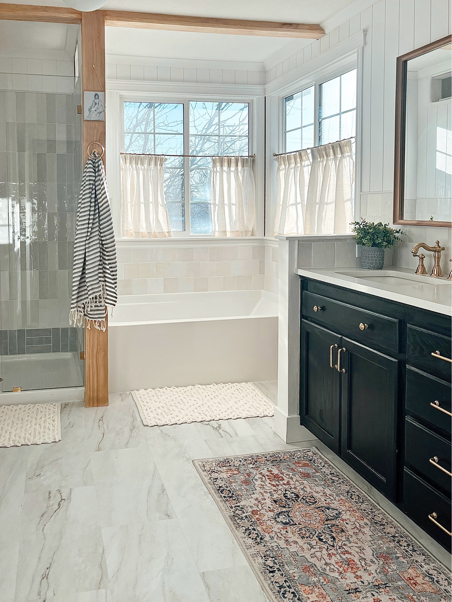 Vintage inspired bathroom makeover // black vanity // brass // gold hardware // Cloe tile // bathroom rug // vanity mirror // bathroom sconce 

#LTKHome