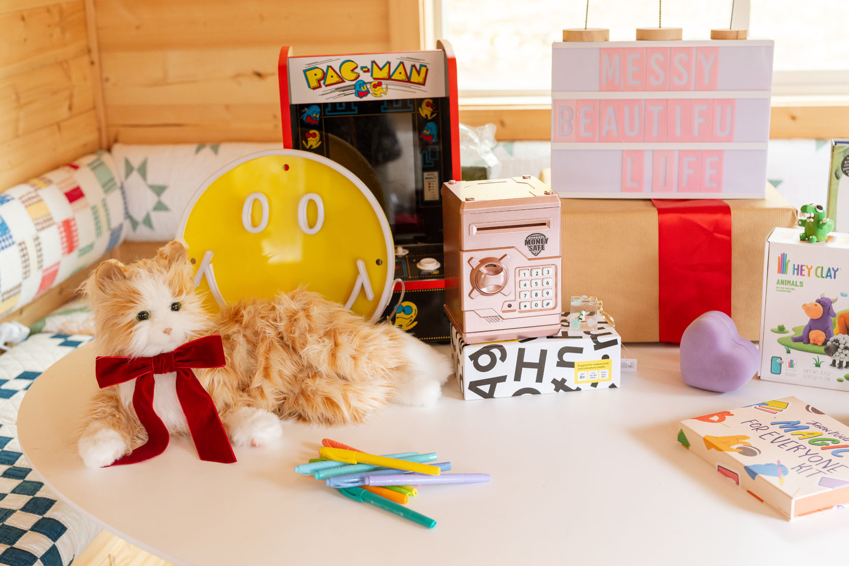 Comfort Robo Cat – our kids were begging for a cat, I’m allergic and we were afraid our dogs would kill a kitten, so I found these comfort animals for senior citizens. And well, the rest is history. They got these two years ago and still love them. They purr, roll over, clean their paws and y’all, on a bad day I might pick one up and let it soothe me. They aren’t cheap, but cheaper than cleaning up the tears you’ll have when your kid won’t clean the litter box and you lose your mind having to be in charge of one more thing.

Charlie wants a vintage Game Boy (Urban Outfitters sells refurbished ones – the yellow one on the right) but those are really splurgy. We also got them those pocket Game Boys for their stockings (Tetris and Pacman). Yes, our kids are super into tech, tis the age, so trying to find non-addictive video games or YouTube-based toys is hard. Also, both our kids switched to Kindles for reading (less book clutter) and they love their iPads to make stop motion videos, music videos and use the Procreate and Canva apps. We got them for the birthdays on the last Target Circle sale so def wait til Black Friday for those, and while they are more expensive than tablets, they can do the above things on them which they love (and better for travel as they can download more shows to watch).

The ATM and the disco ball rotating light are two that have been popular in our house with both kids for years (we actually just rebought Elliot’s ATM after 4-5 years because it finally broke). Hot tip: plug in the disco ball for when they come down the stairs, it’s SO FUN (it comes with the right lights, and spins to reflect all over the walls and ceilings versus having to hang from the ceiling and rig up lights – don’t bother with those). Also, these plug-in disco ball lightbulbs are SUCH A HIT and for $12 for TWO, a great price.

#LTKKids #LTKGiftGuide #LTKCyberWeek