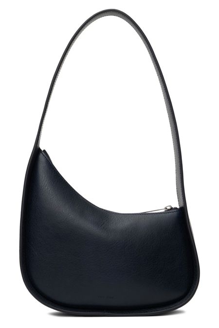 The Row Half Moon Bag now comes in navy blue!

#LTKitbag #LTKstyletip #LTKSeasonal