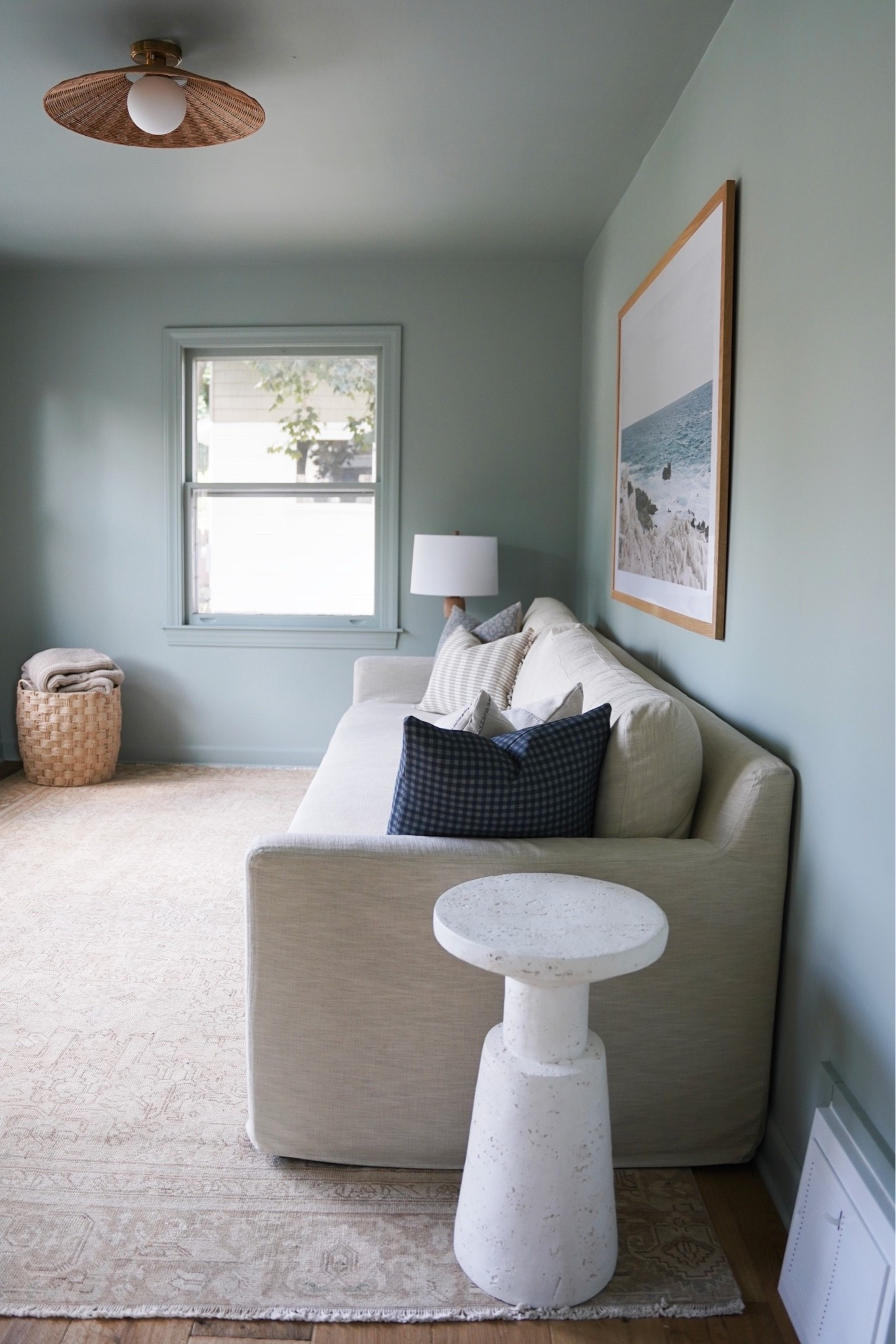 Cottage family room! Paint is SW Oyster Bay. Rug is vintage. Basket is HomeGoods

#LTKHome
