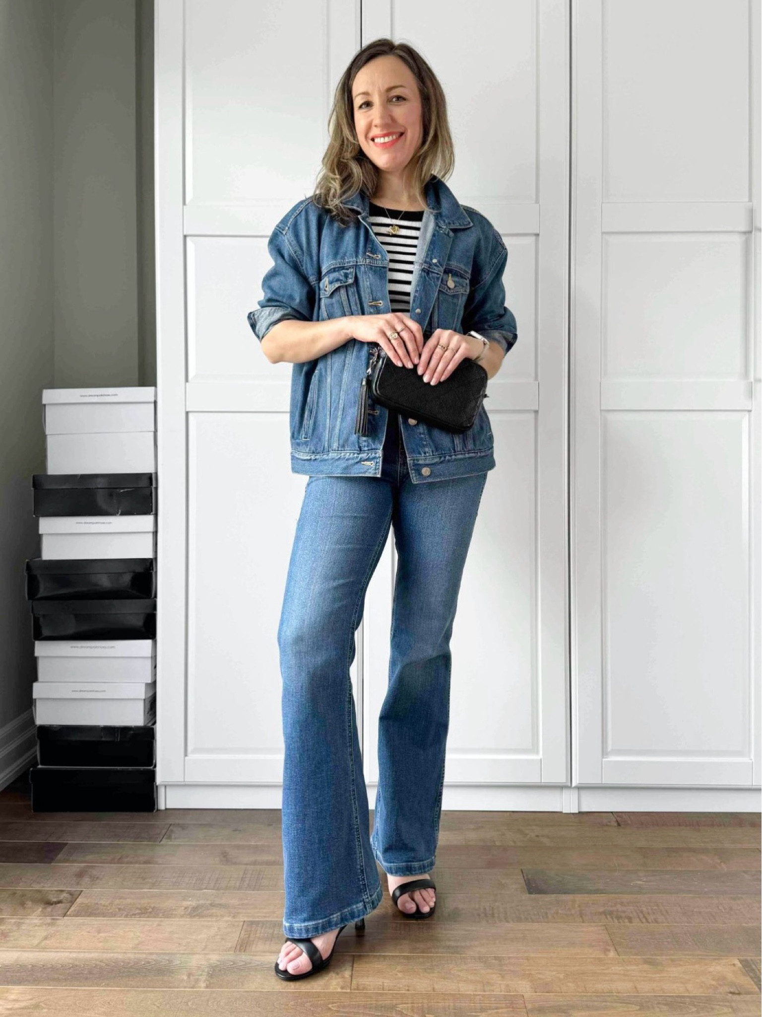 Denim in denim outfit with flare jeans and striped tank 

#LTKOver40 #LTKFindsUnder50