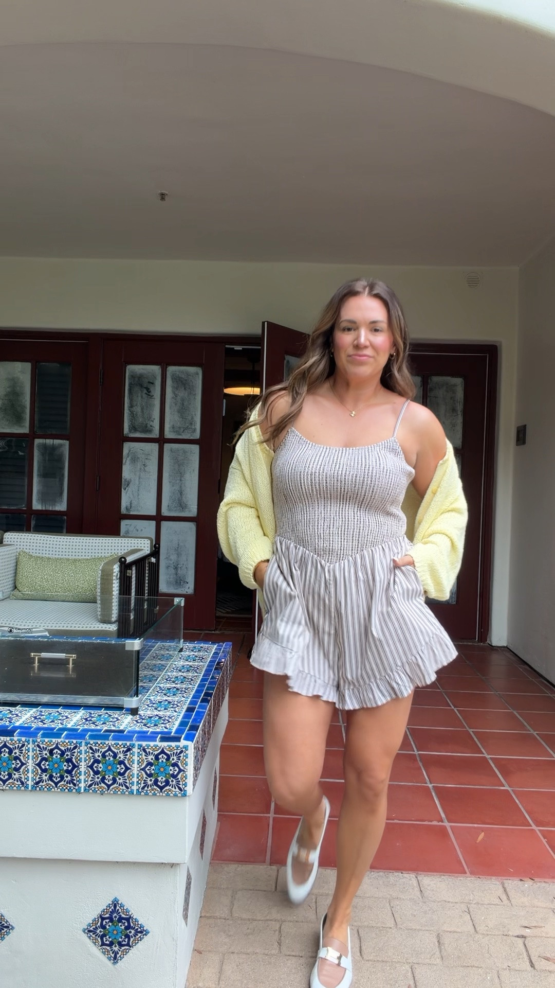 my travel home outfit from our trip! wearing size large in brown stripe romper and size medium in butter yellow cardigan. it’s oversized! so comfy! loafers are Hermes

#LTKSeasonal #LTKMidsize #LTKTravel