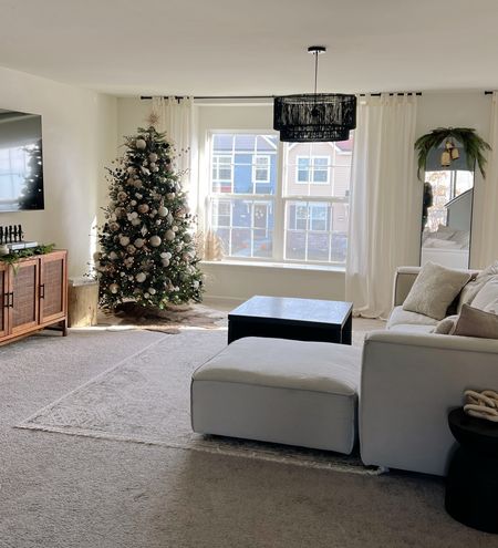 Living Room at Christmas. Holiday Decor. Tree. Entertain Center. Couch. Light Fixture. Mirror

#LTKhome