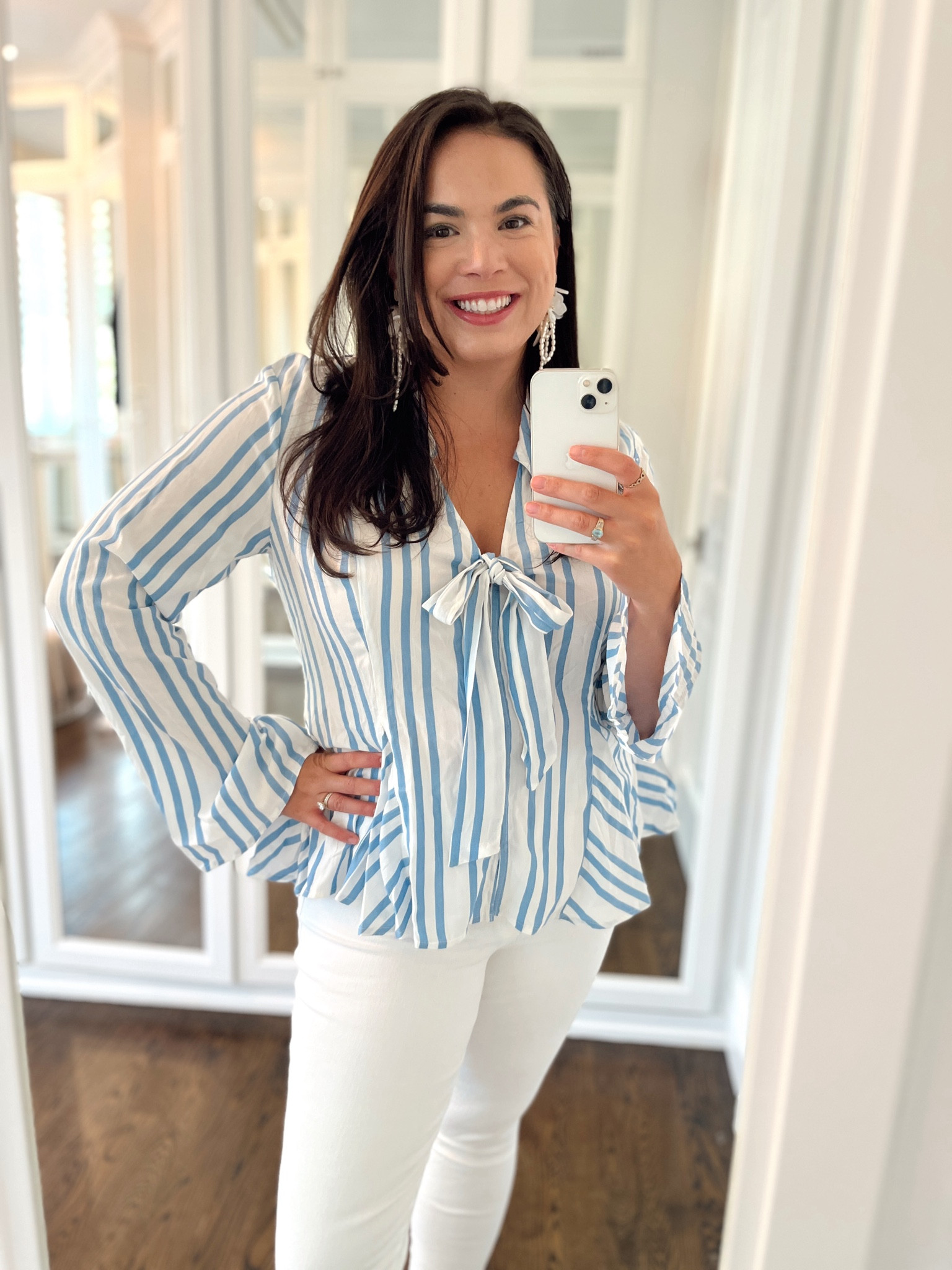 Obsessed with this tie-front blouse from Anthropologie. The fabric buttons are so chic and the silhouette is so flattering 

Also wearing my new favorite pearl statement earrings and my tried and true Spanx jeans 

#LTKSaleAlert #LTKStyleTip #LTKSummerSales