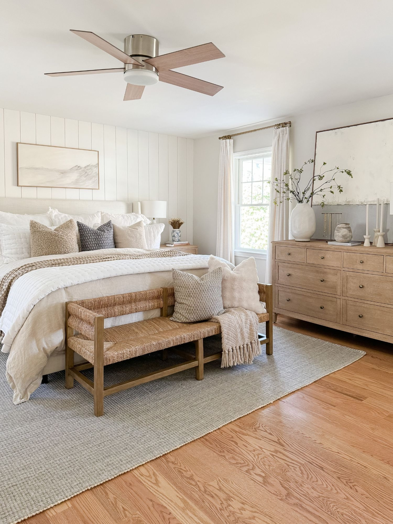 Layered bedding, warm wood tones, and soft textures make this coastal bedroom feel calm and complete. coastal bedroom decor, neutral bedroom, upholstered bed, woven bench, coastal home style, serene bedroom, timeless interiors, bedroom inspiration, sherricalnanhome

#LTKHome